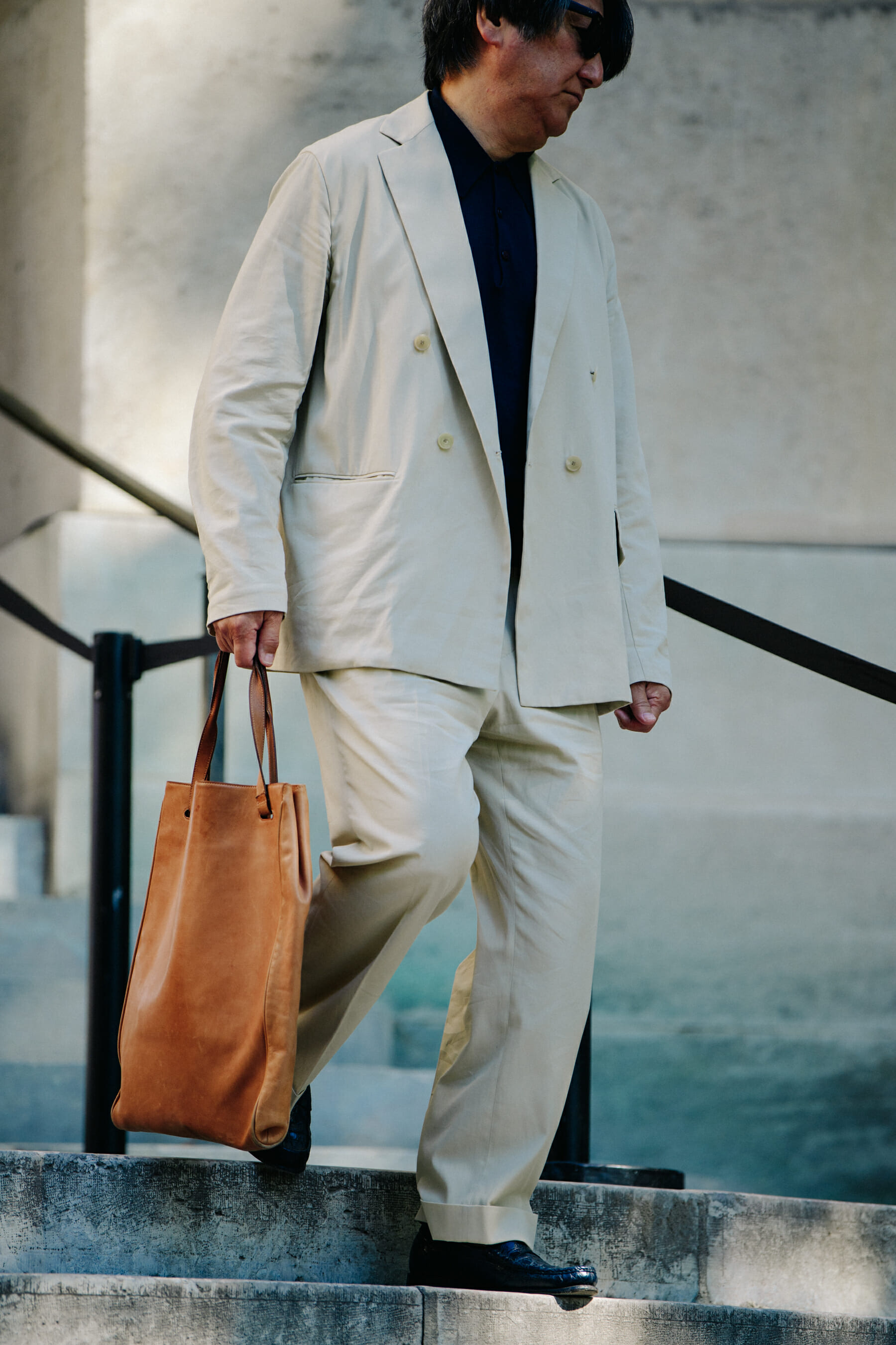 Man wearing white suit