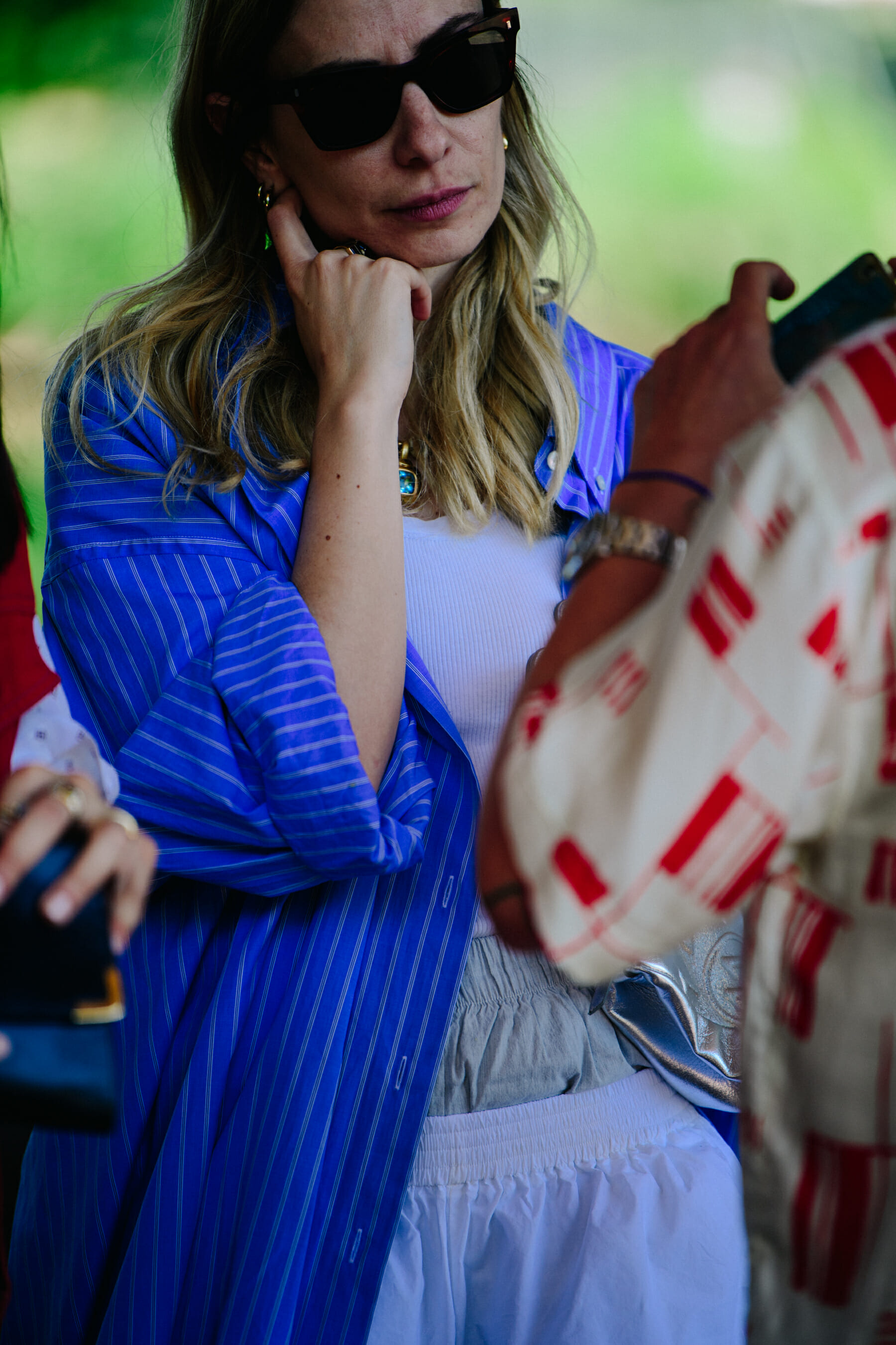 Woman wearing blue striped shirt
