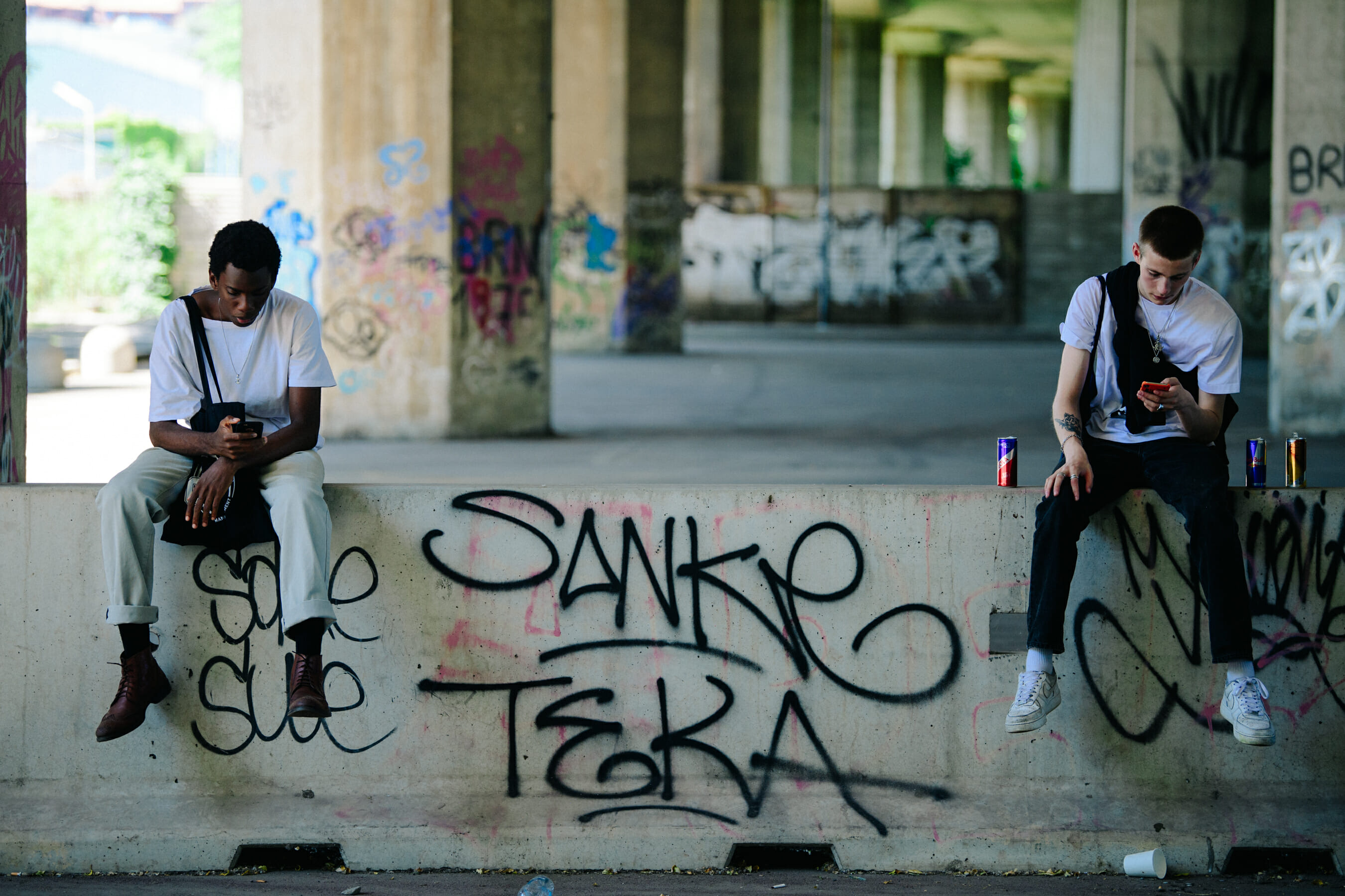 Two models wearing white tee shirts