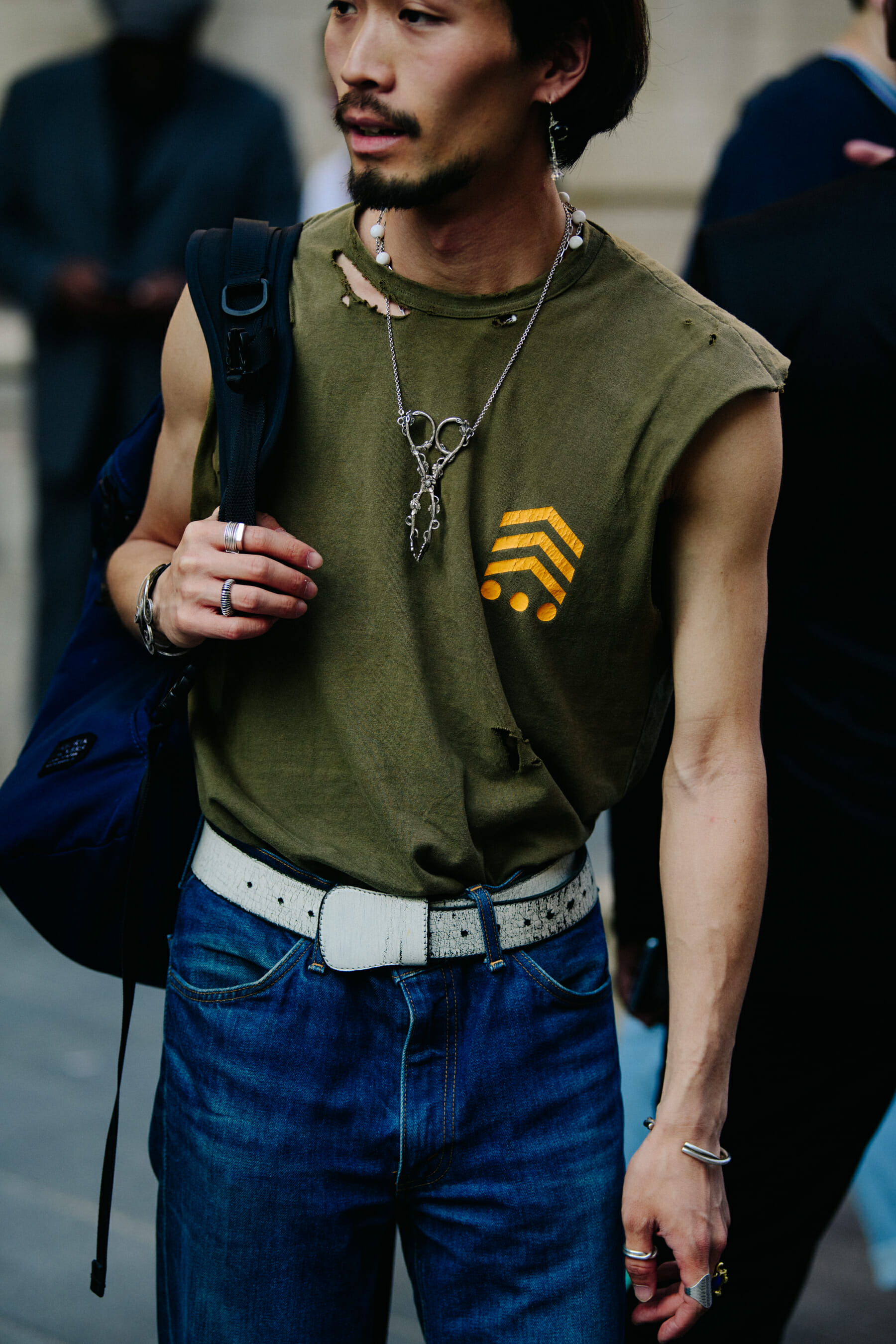 Man wearing green cut off tee