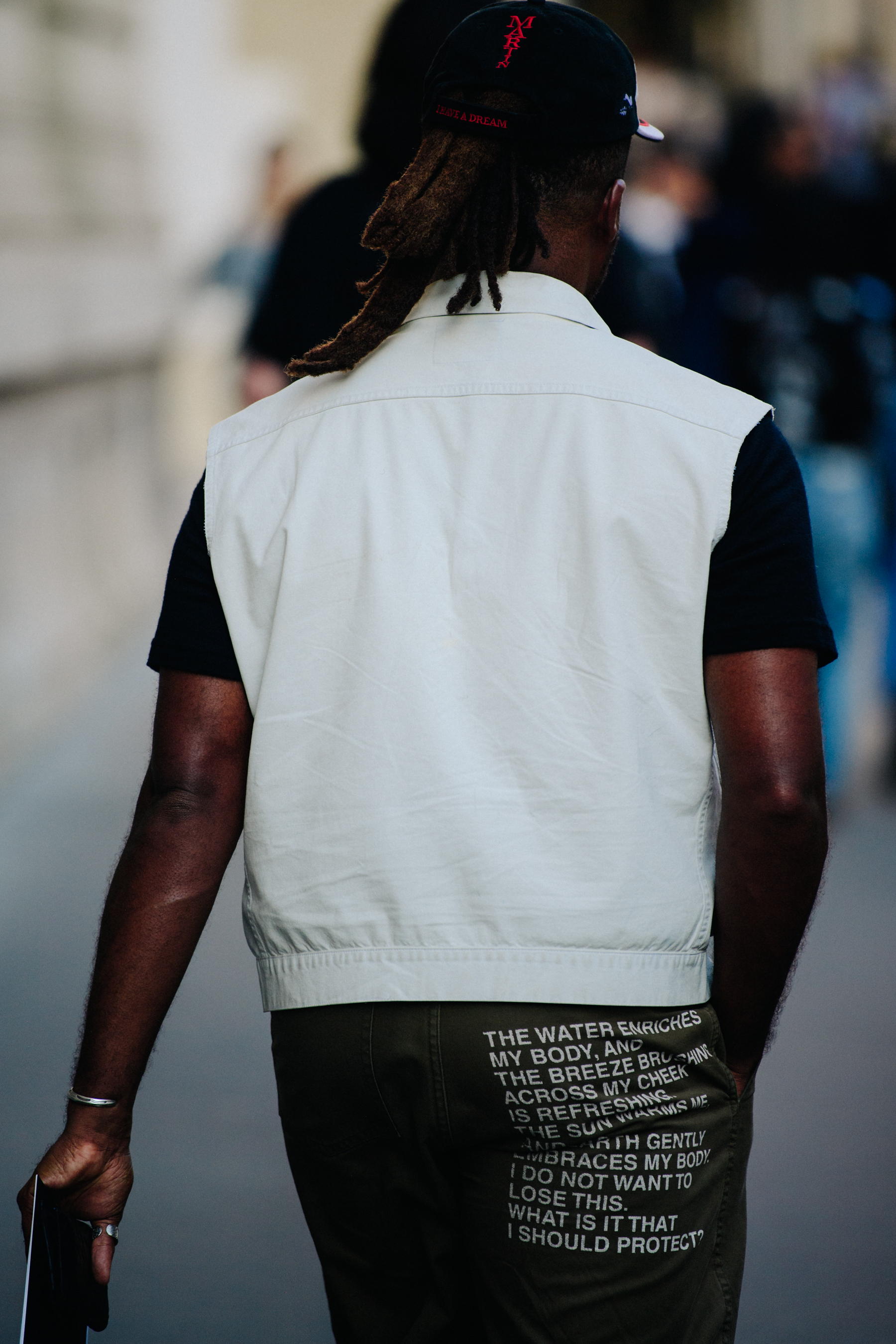 Man wearing white denim vest