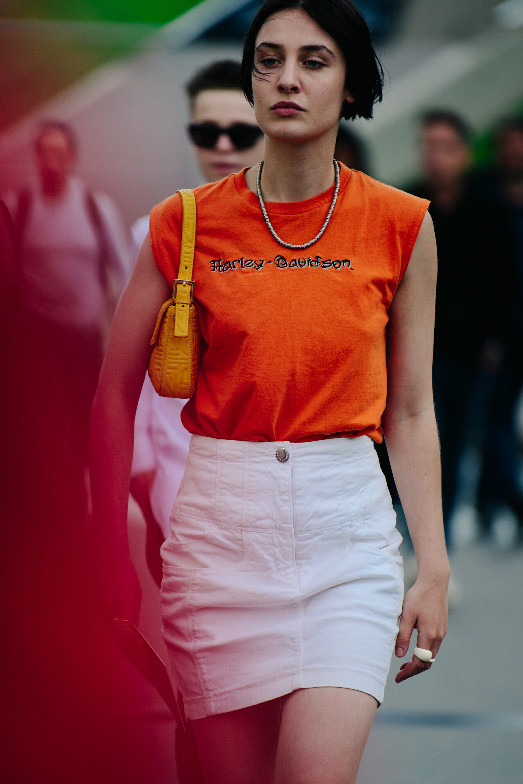 Woman wearing orange vest