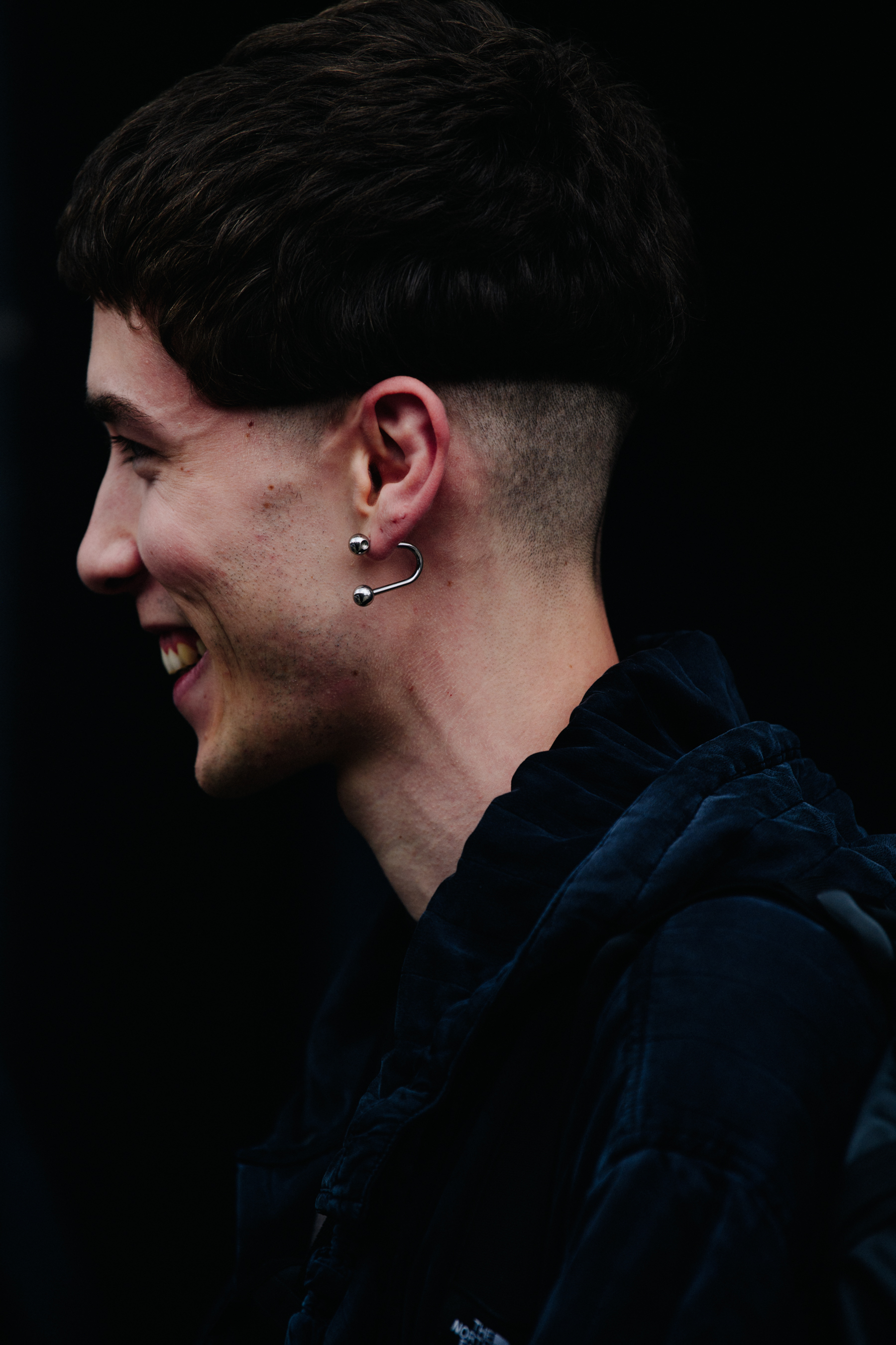 Man wearing silver earring