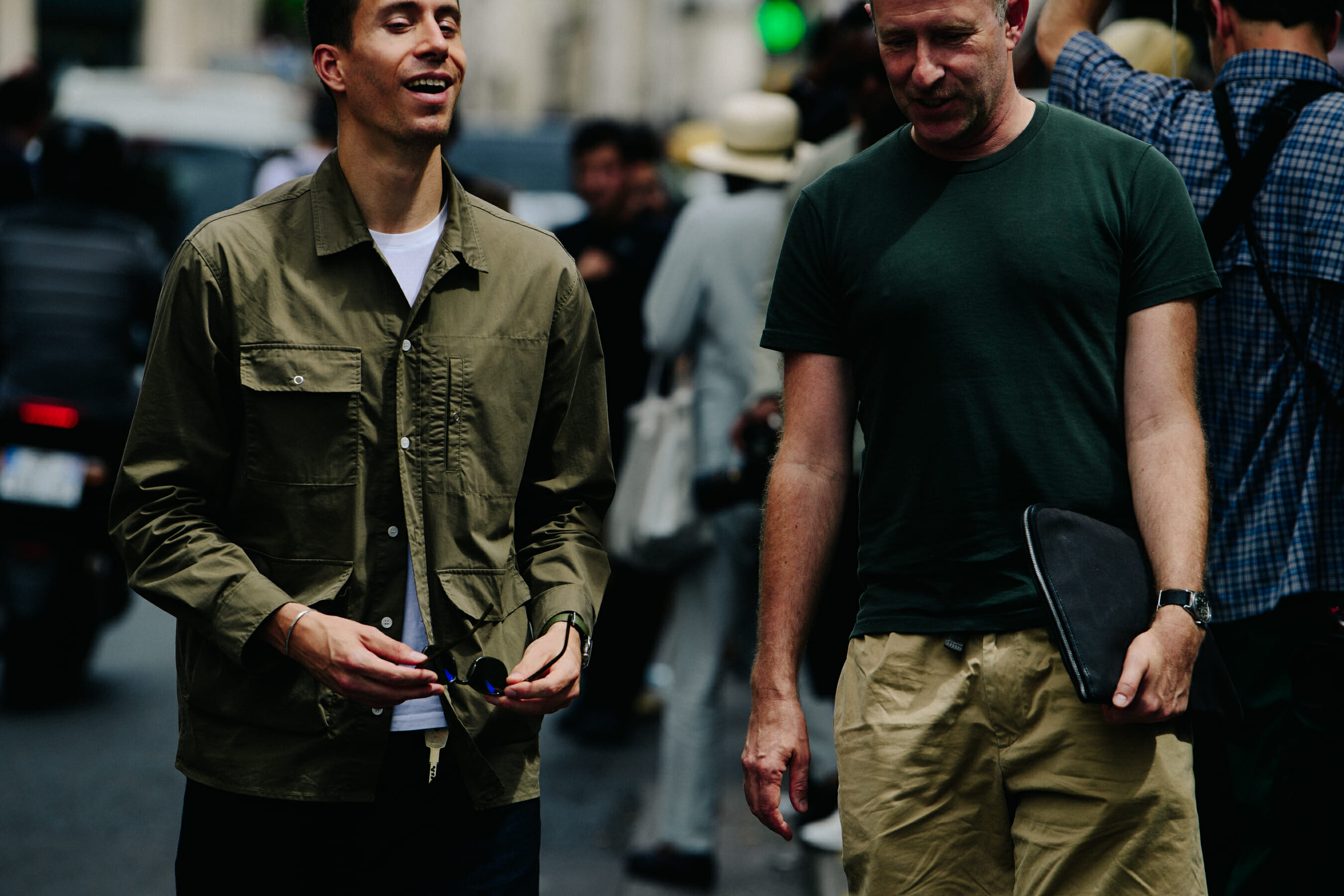 Two men wearing green