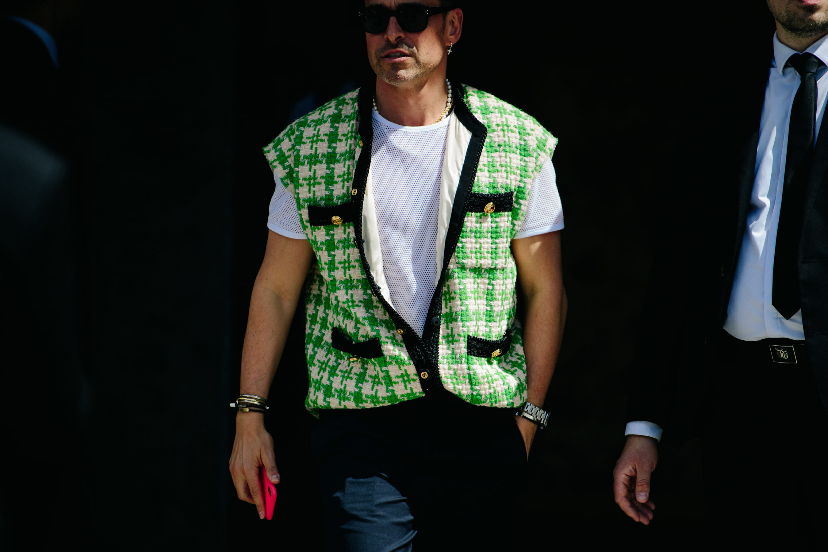 Man wearing green vest