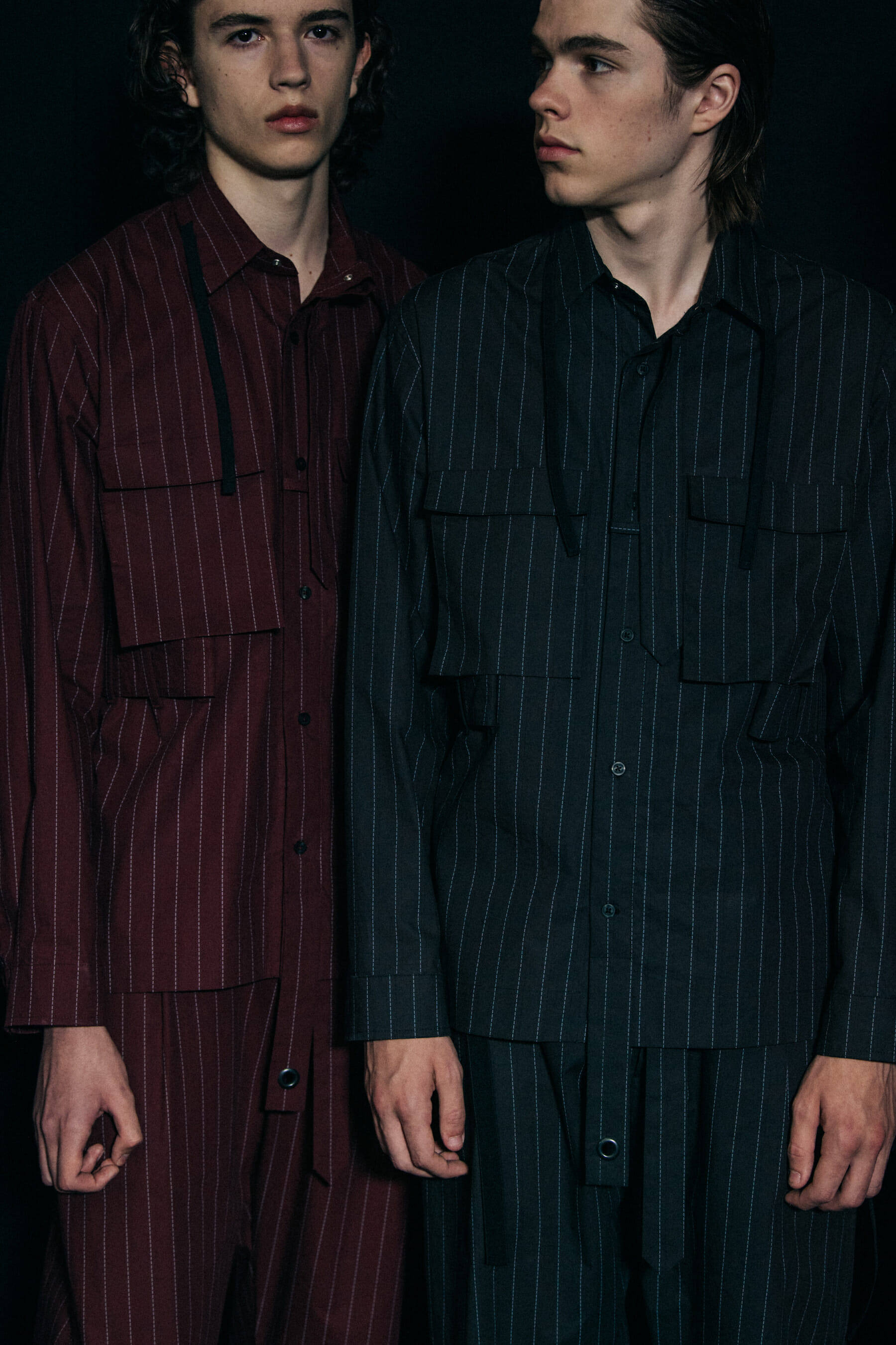 Models wearing dark Craig Green outfits