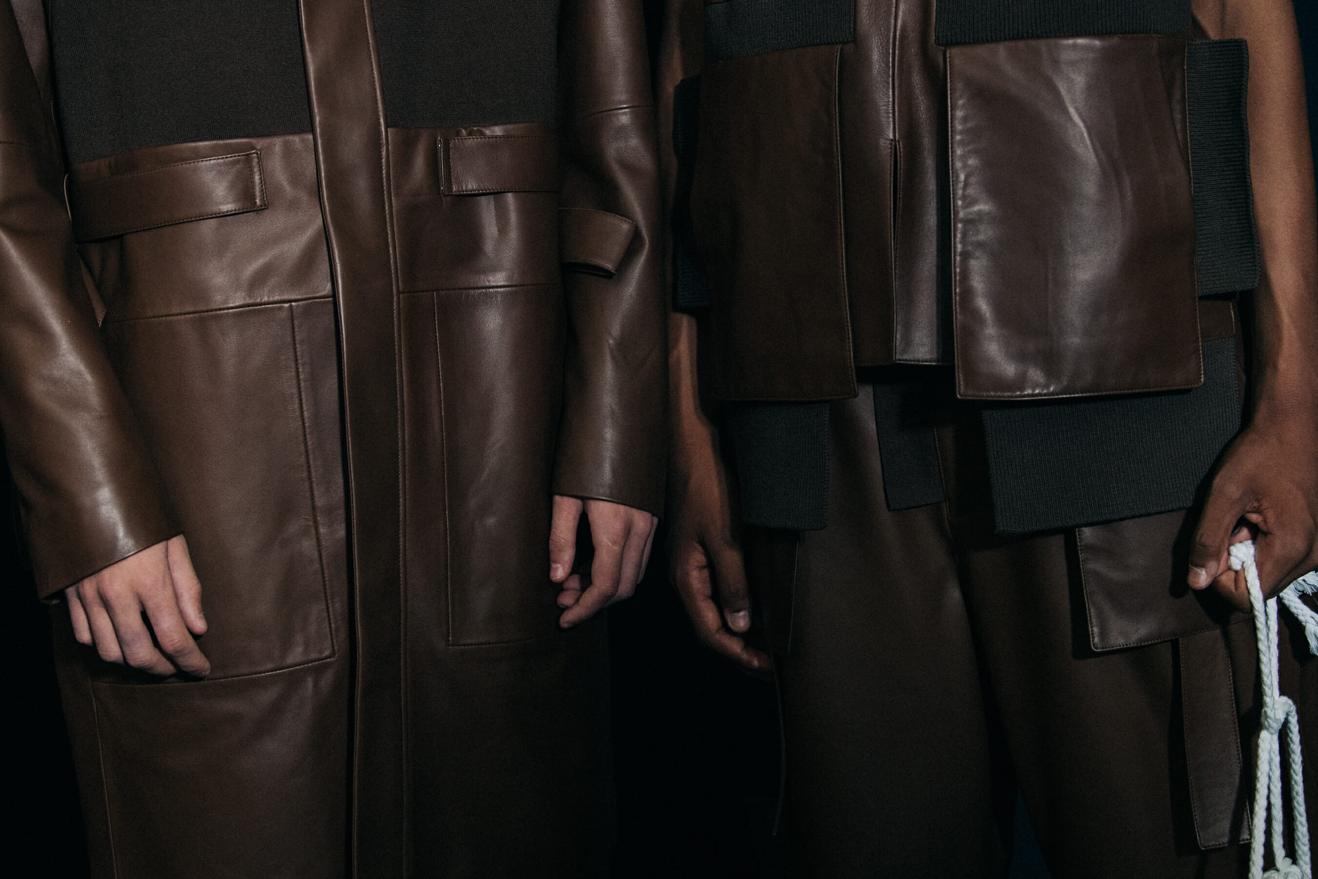 Models wearing dark Craig Green outfits