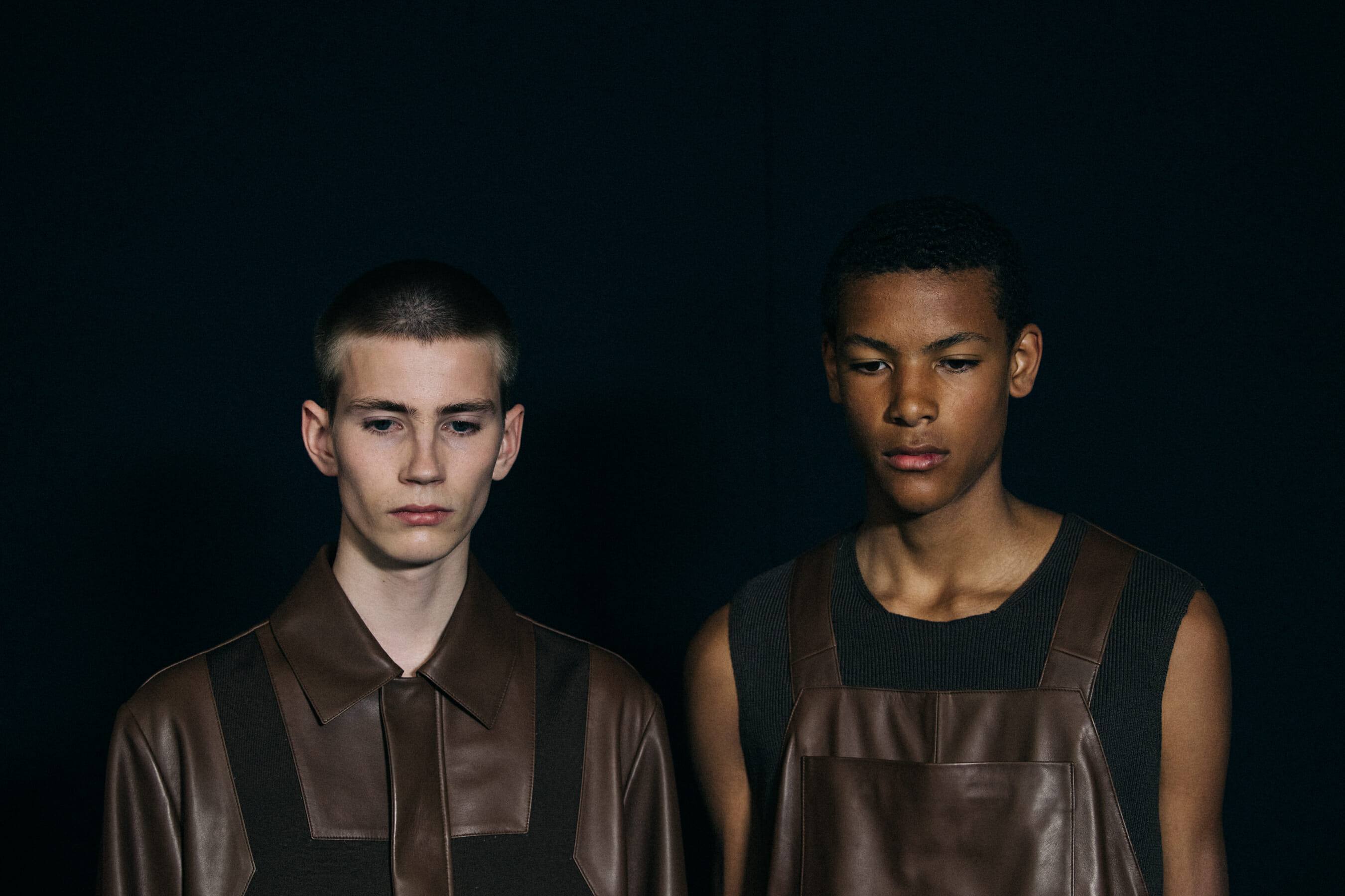 Models wearing dark Craig Green outfits