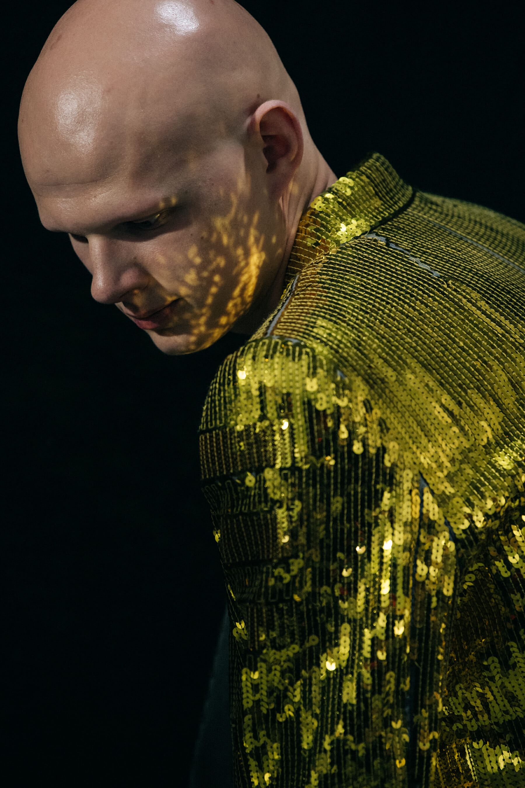 Model wearing gold outfit at Rick Owens