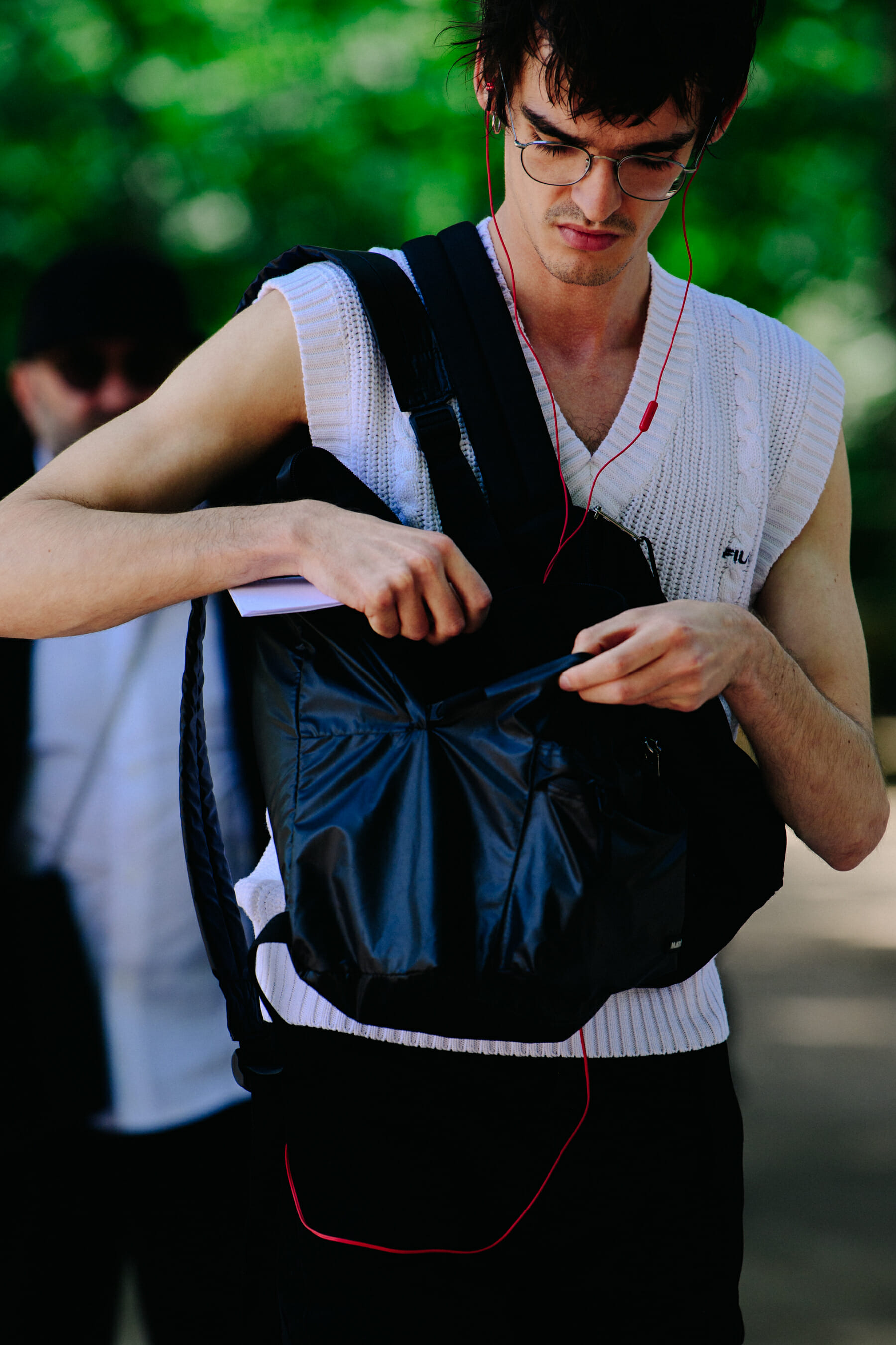 Man wearing white vest