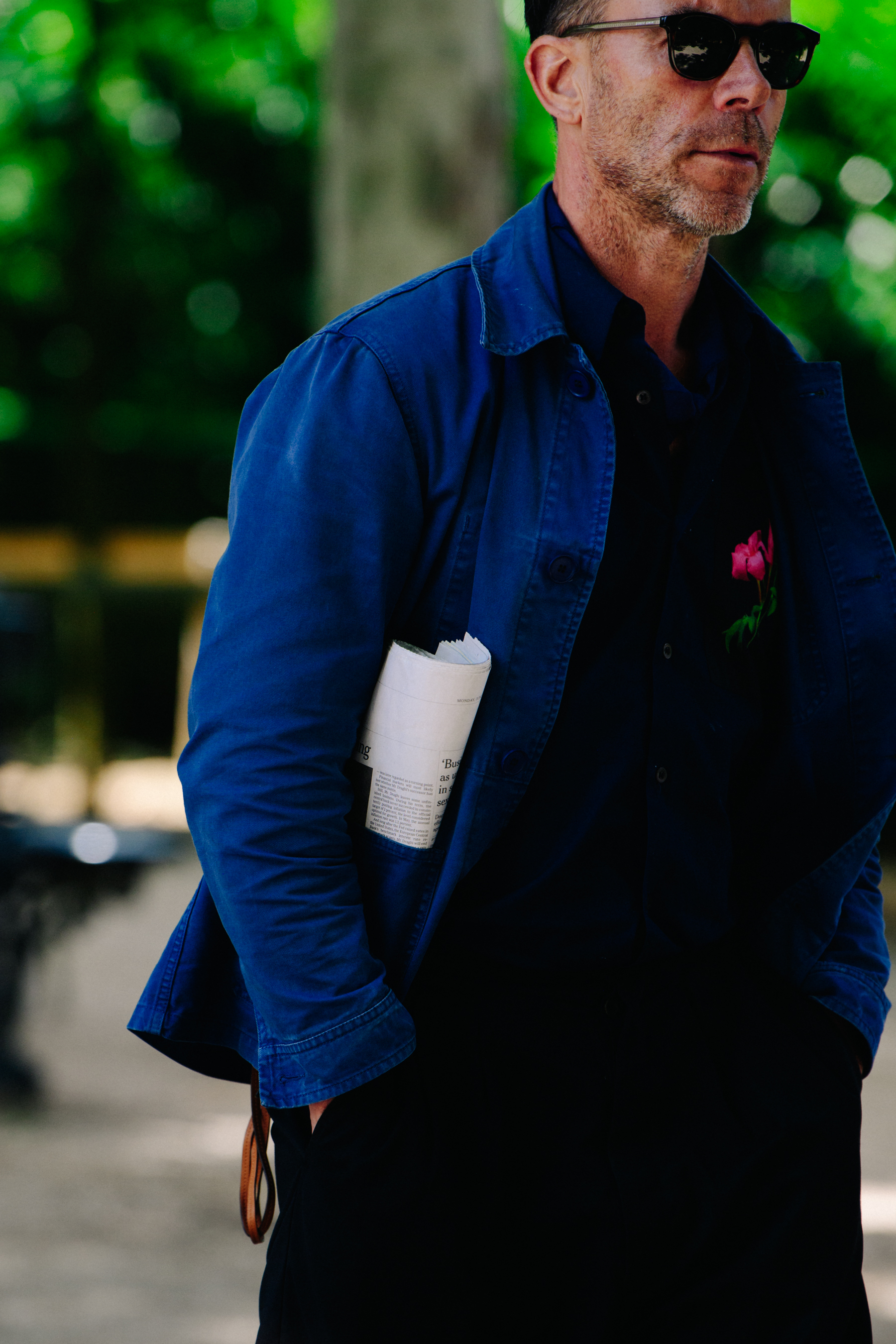 Man wearing blue artists jacket