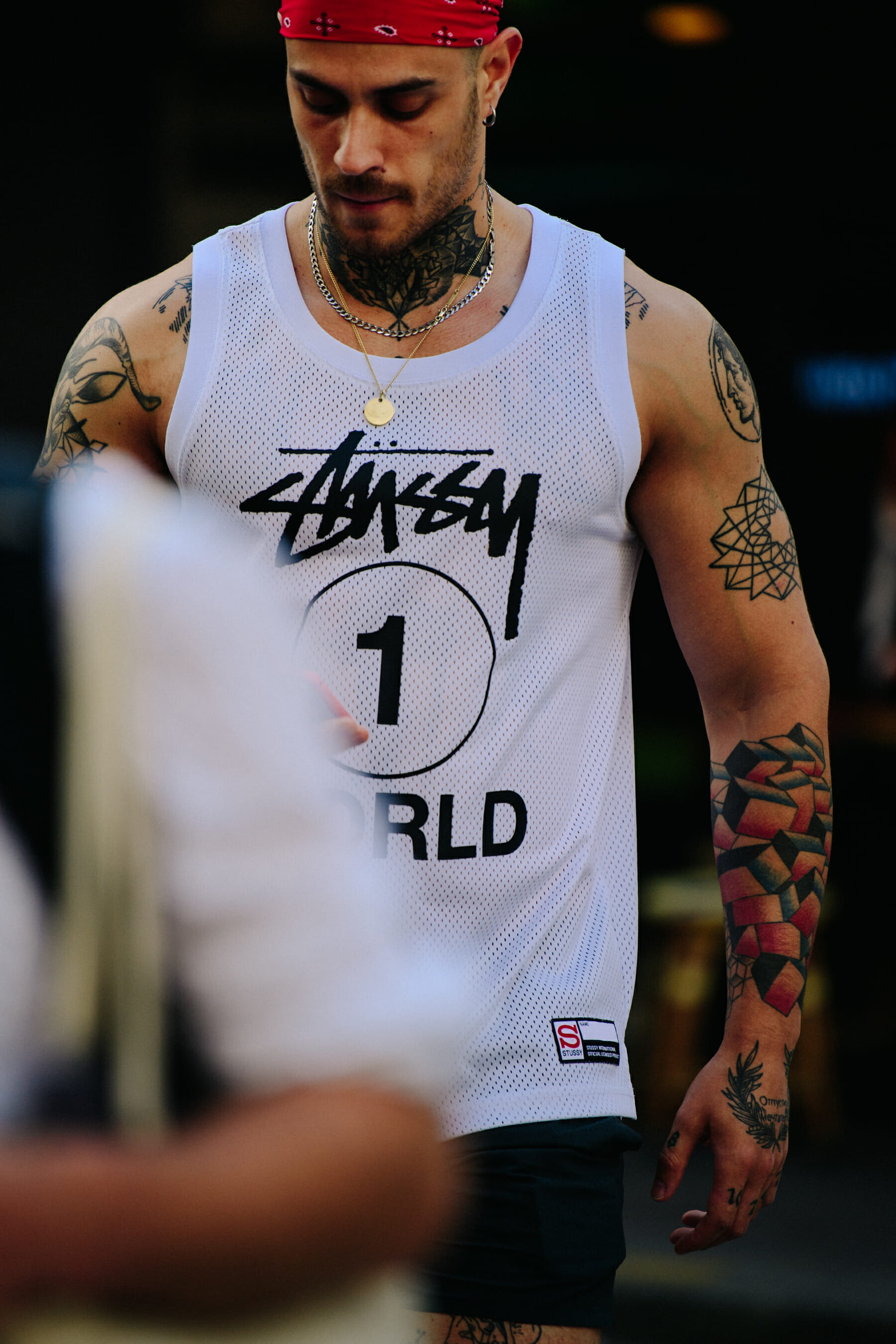 Man wearing Stussy vest