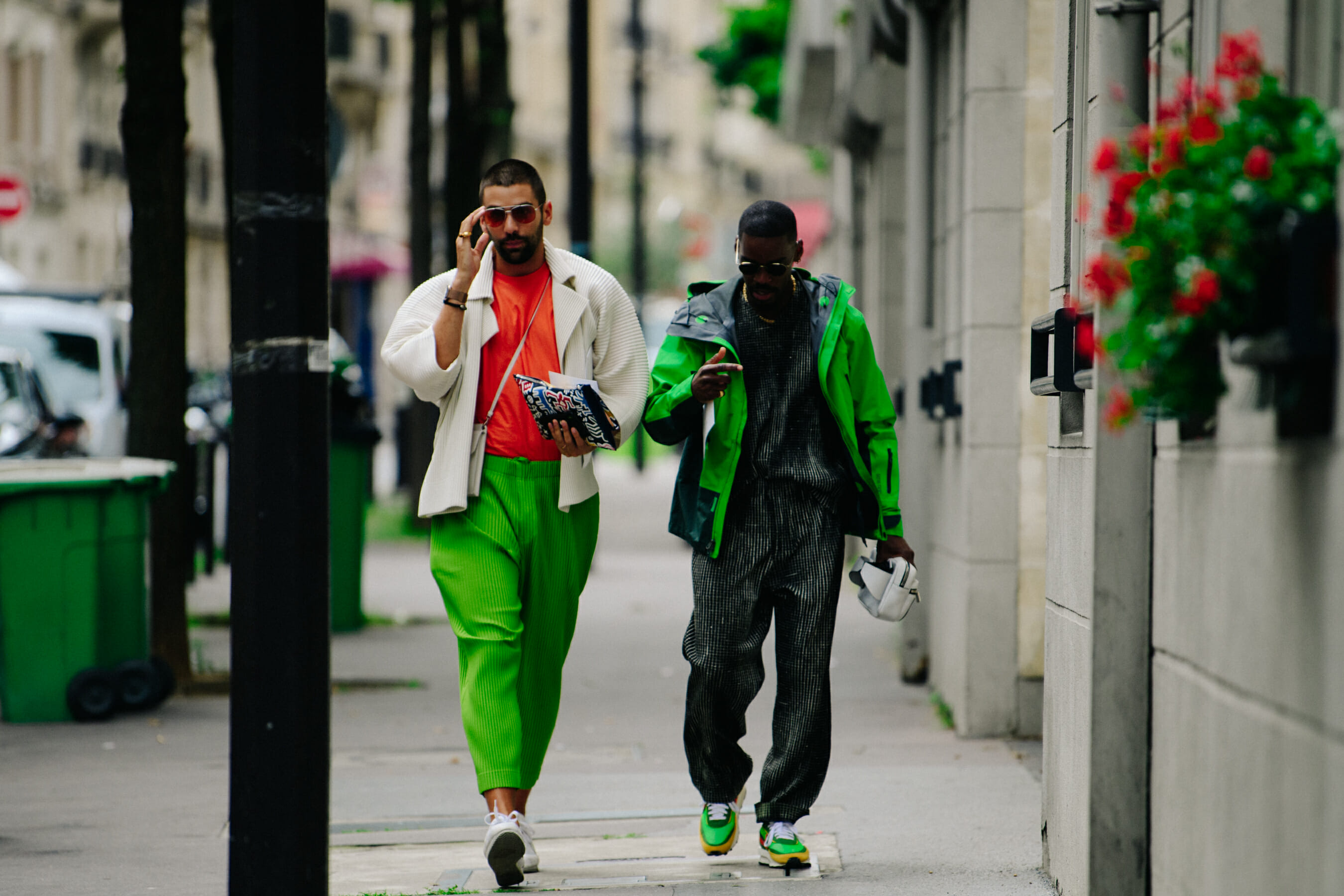 Two men wearing green