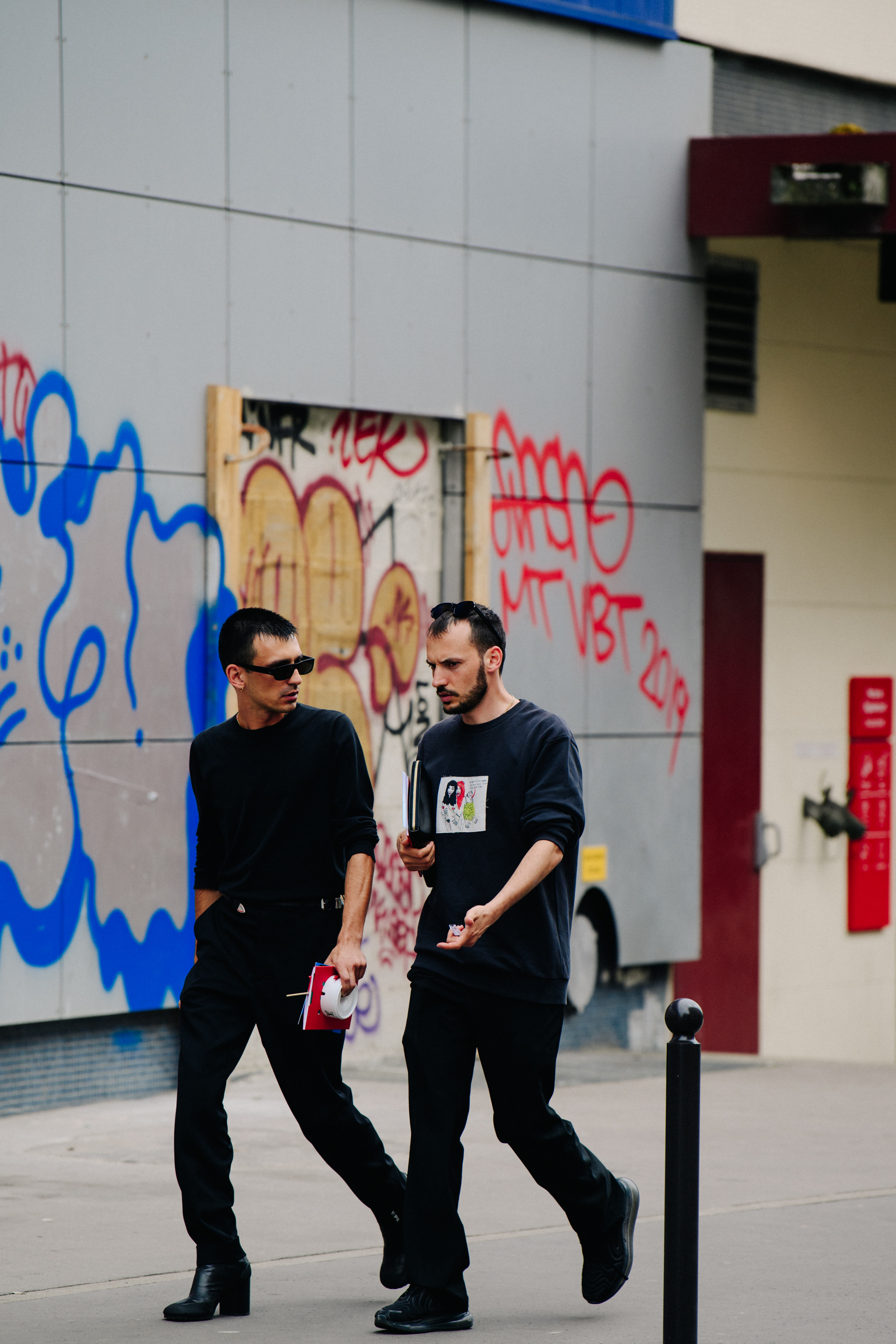 Two men wearing black