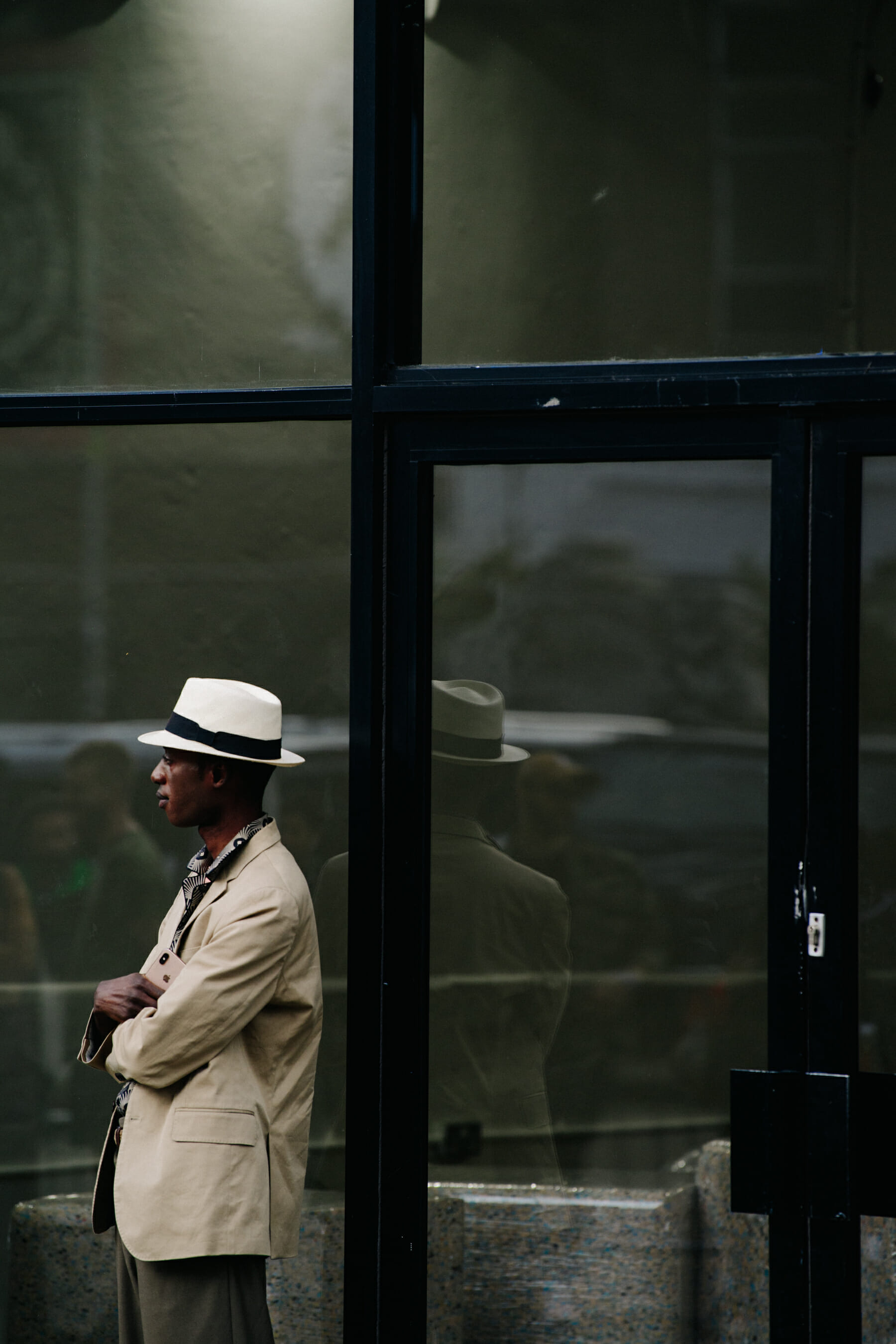 Man wearing cream hat