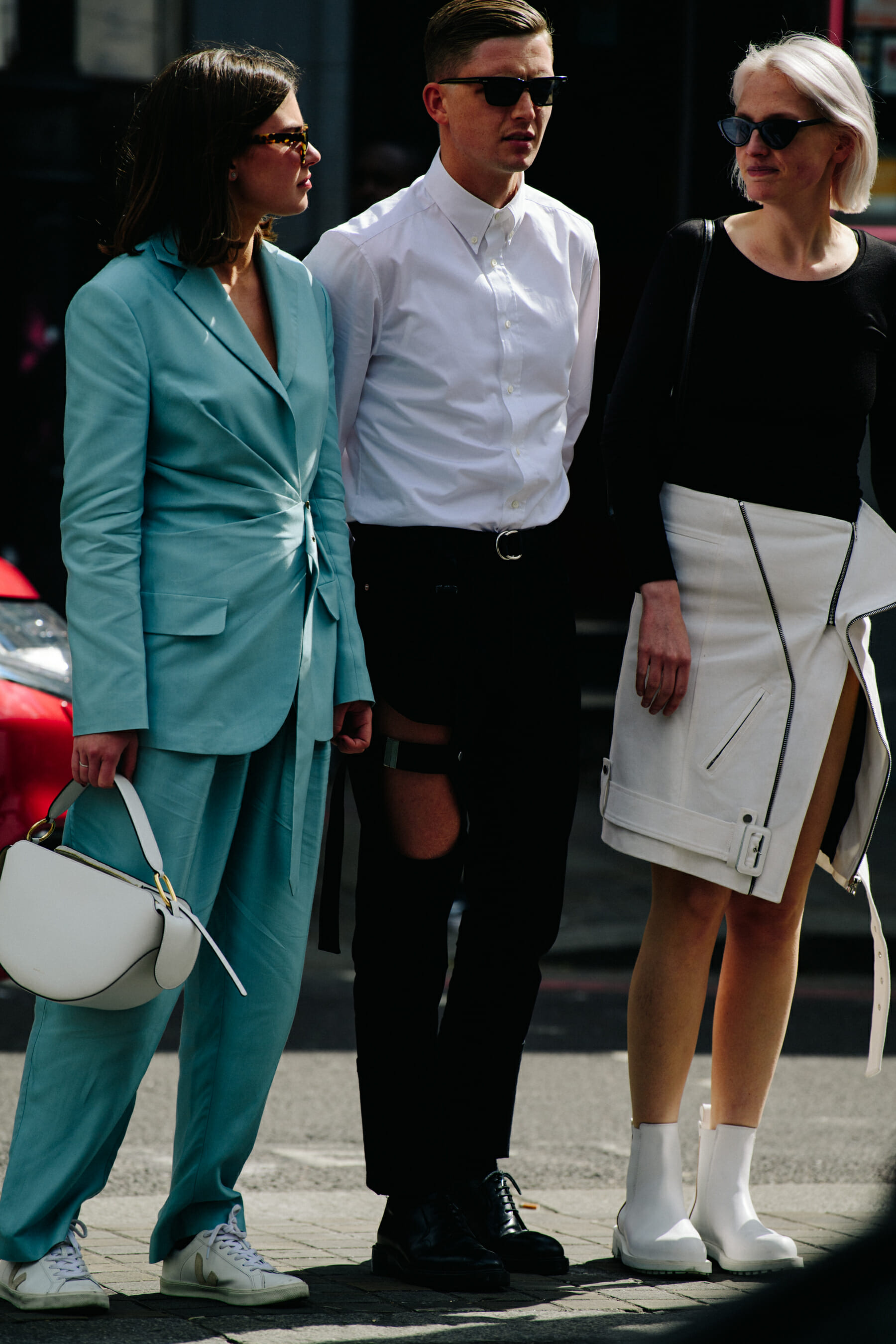 Three people wearing suits