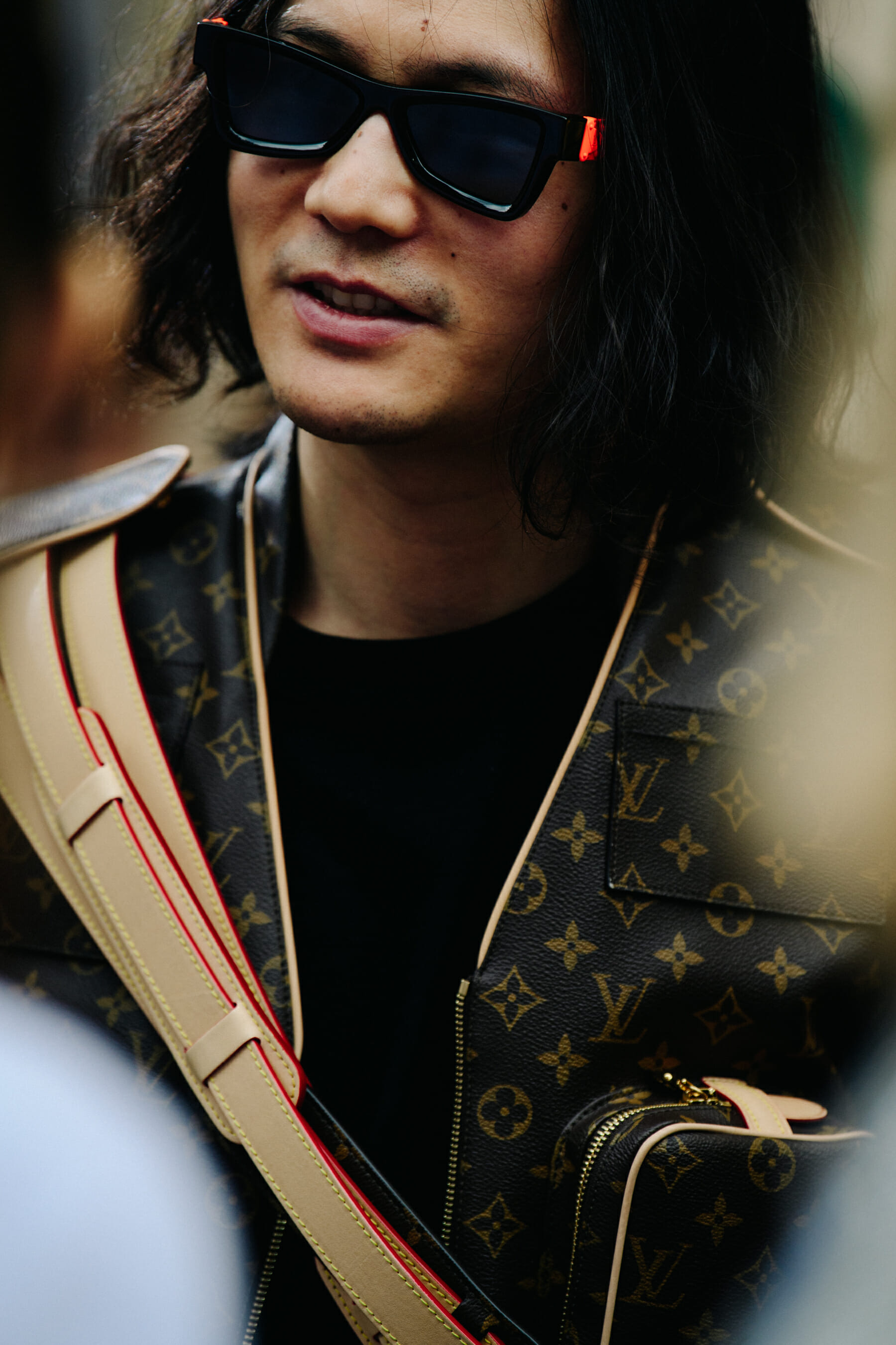 Man wearing Louis Vuitton sunglasses