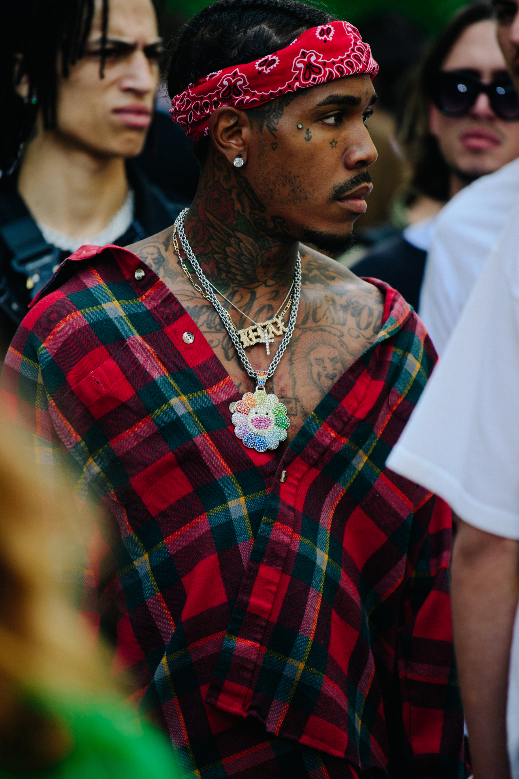 Man wearing large necklace
