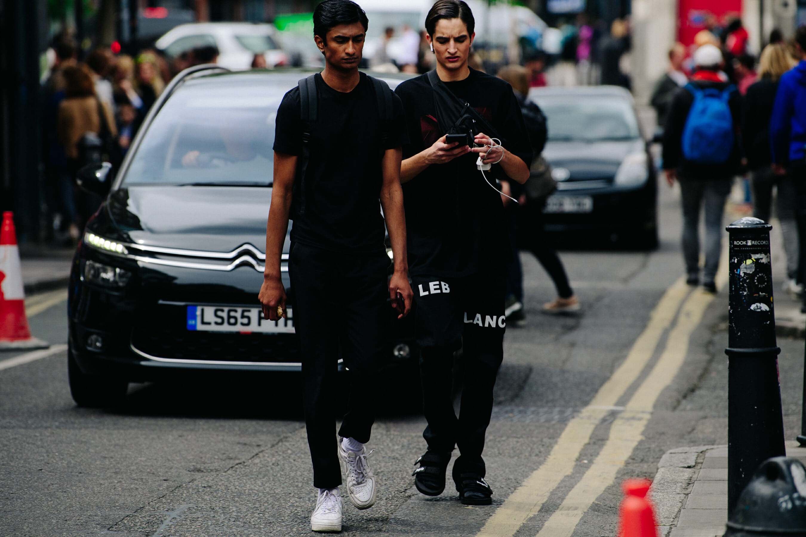Two models wearing black