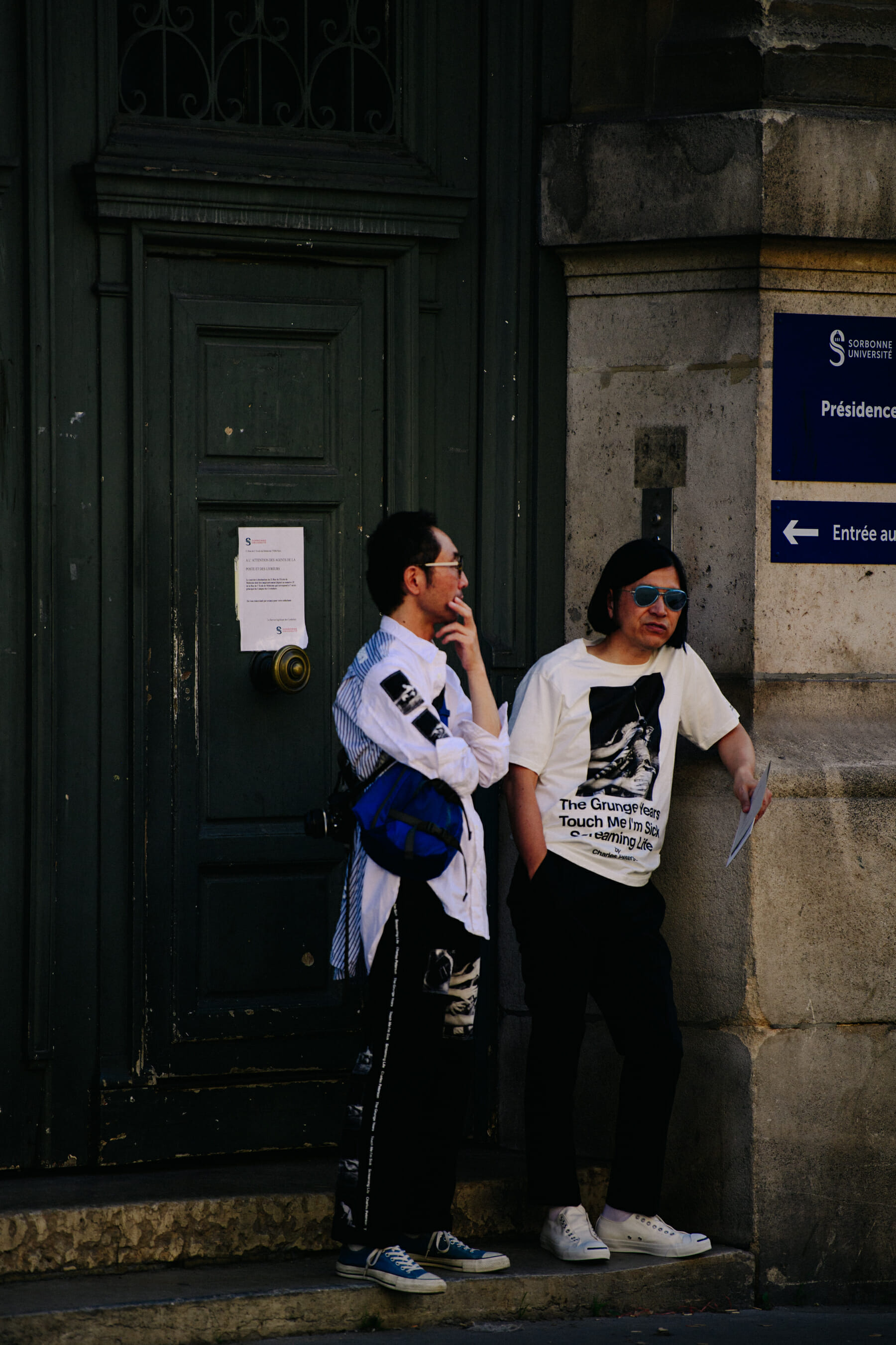 Two men wearing graphic shirts