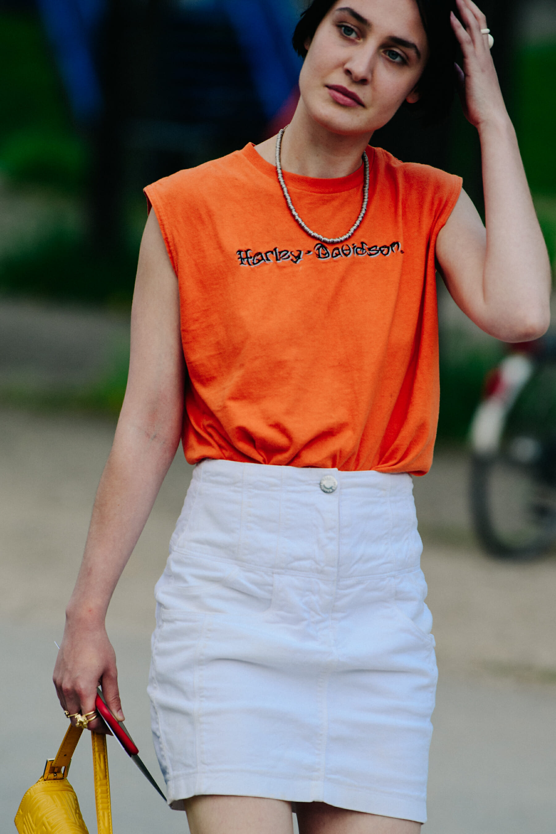 Woman wearing orange vest