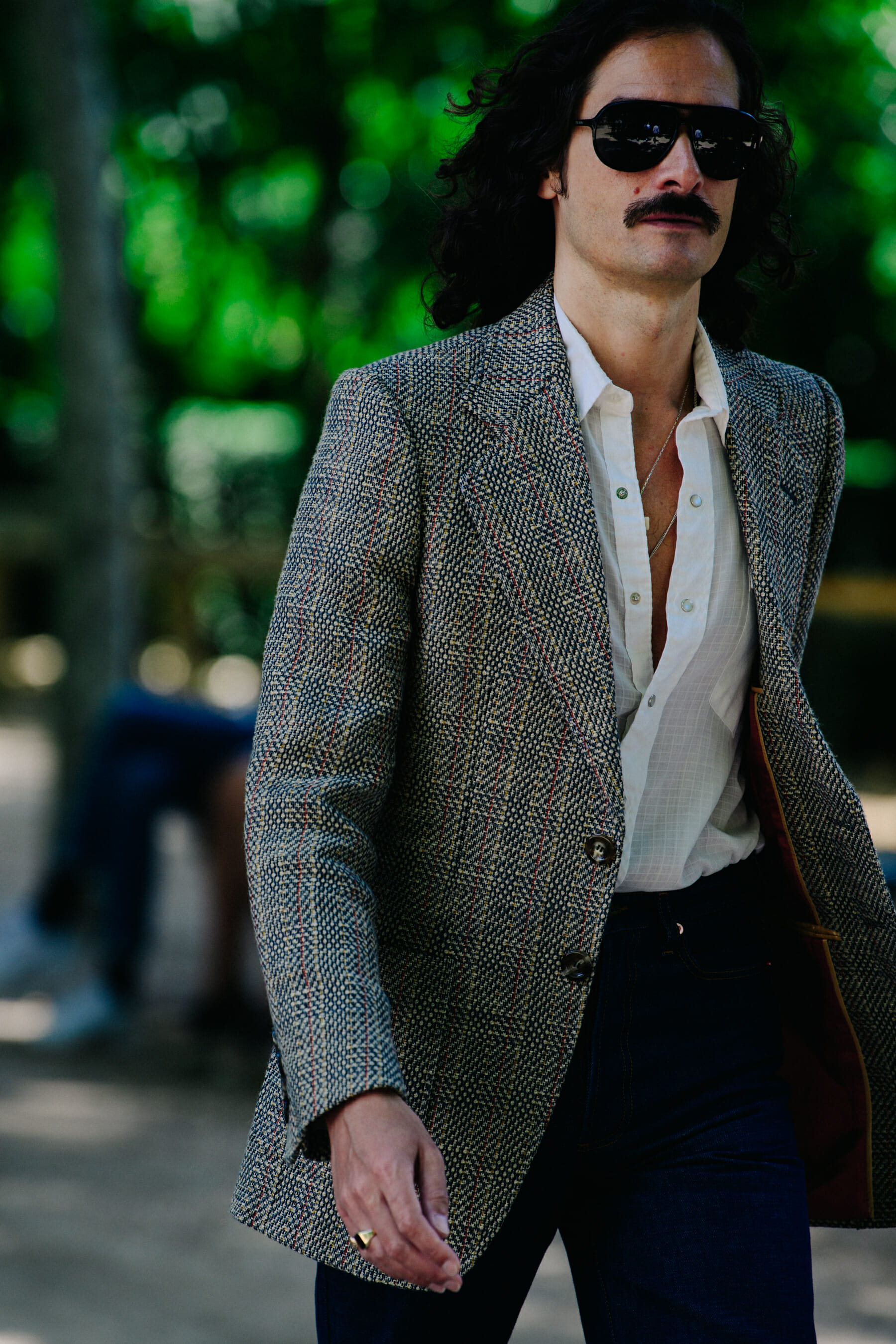 Man wearing open white shirt