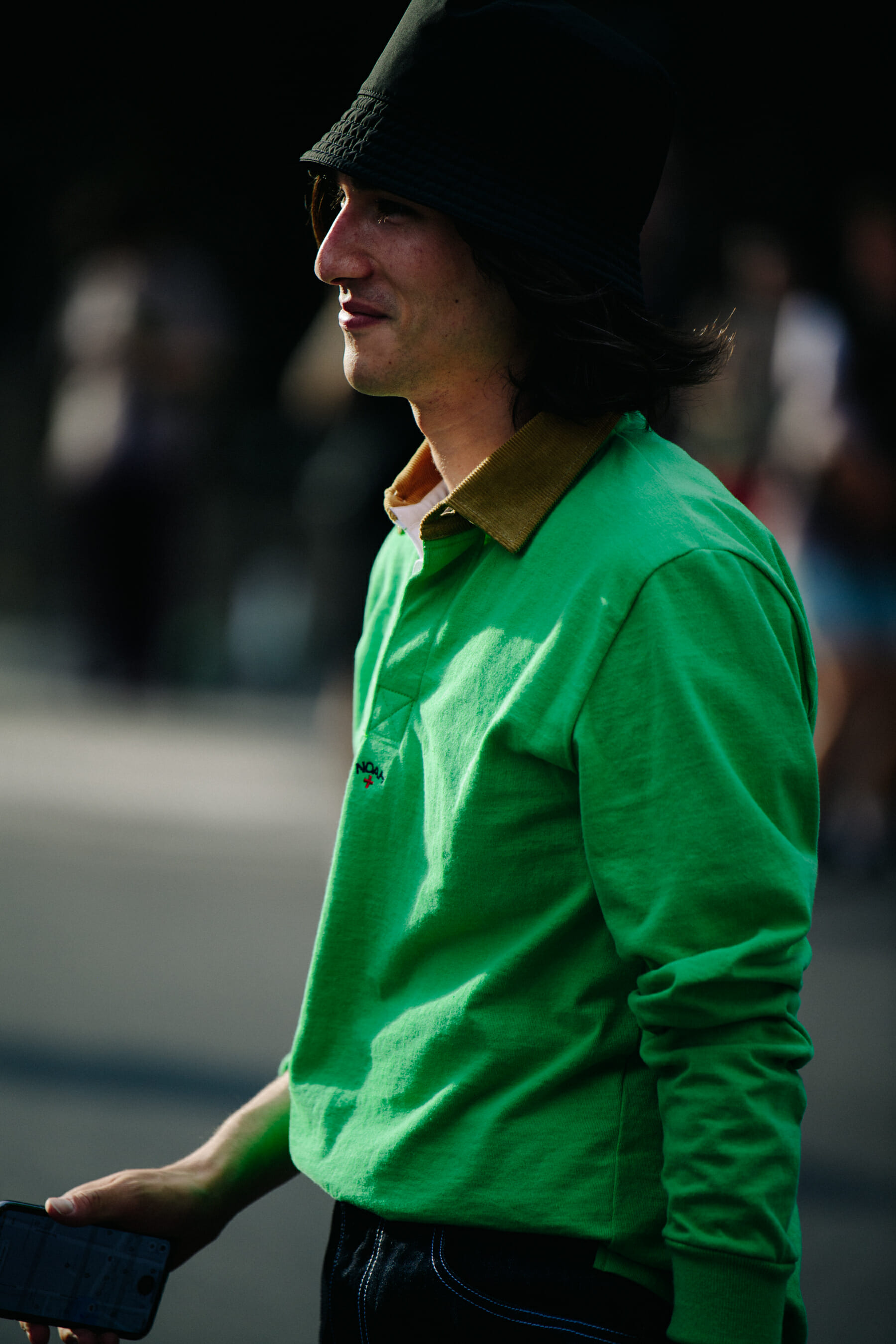 Man wearing green Noah shirt