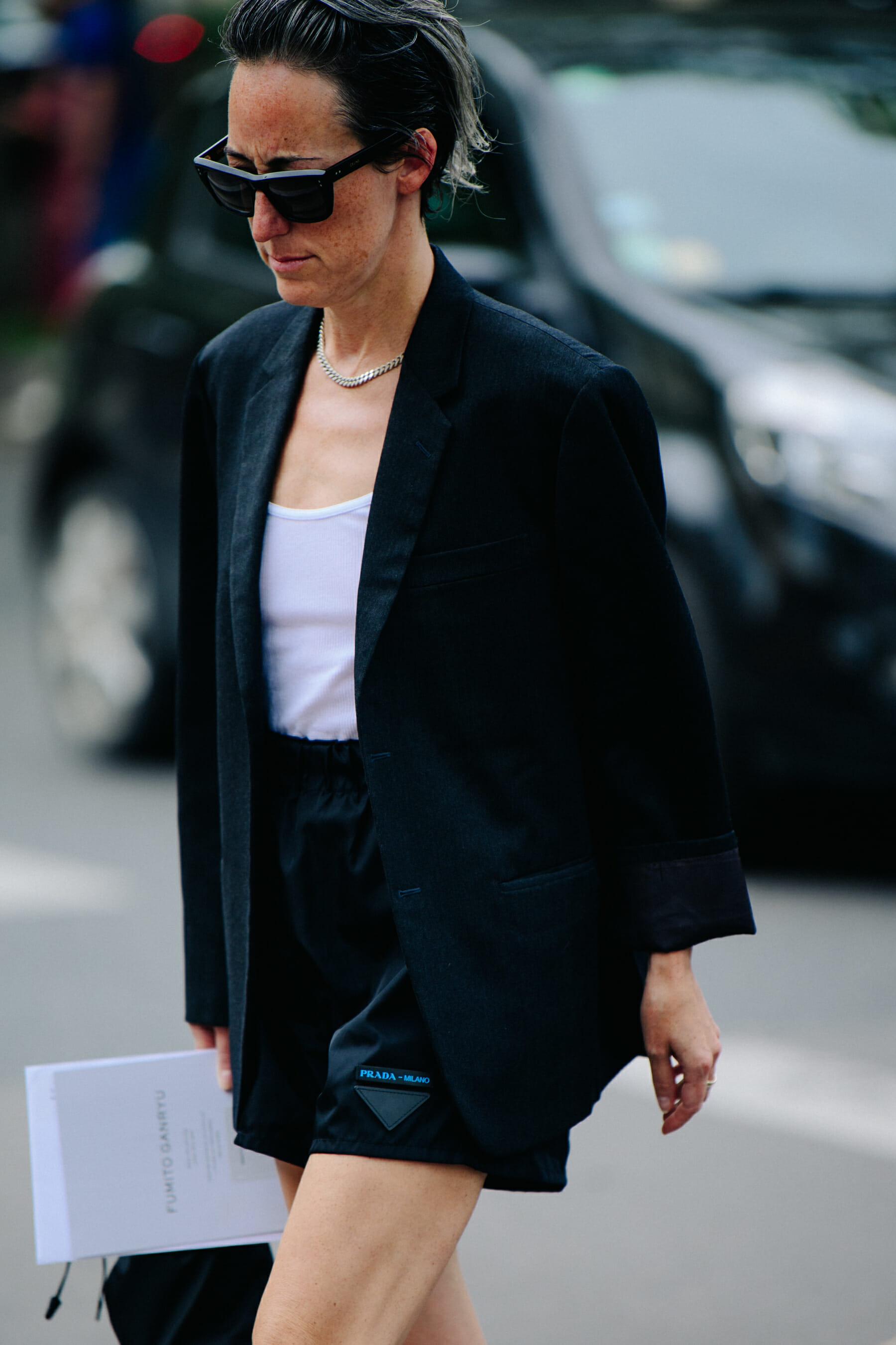 Woman carrying Prada bag