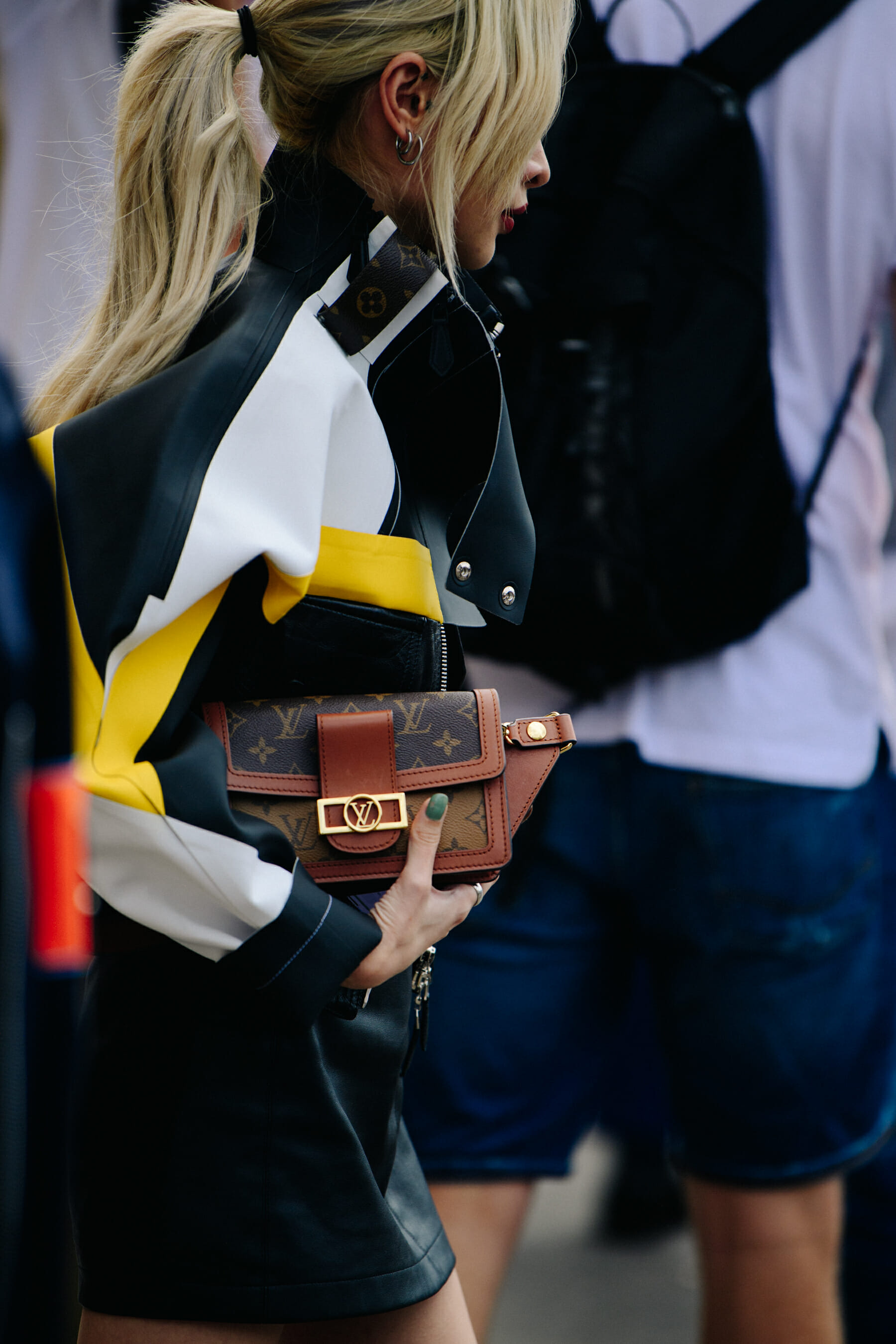 Woman carrying Louis Vuitton bag