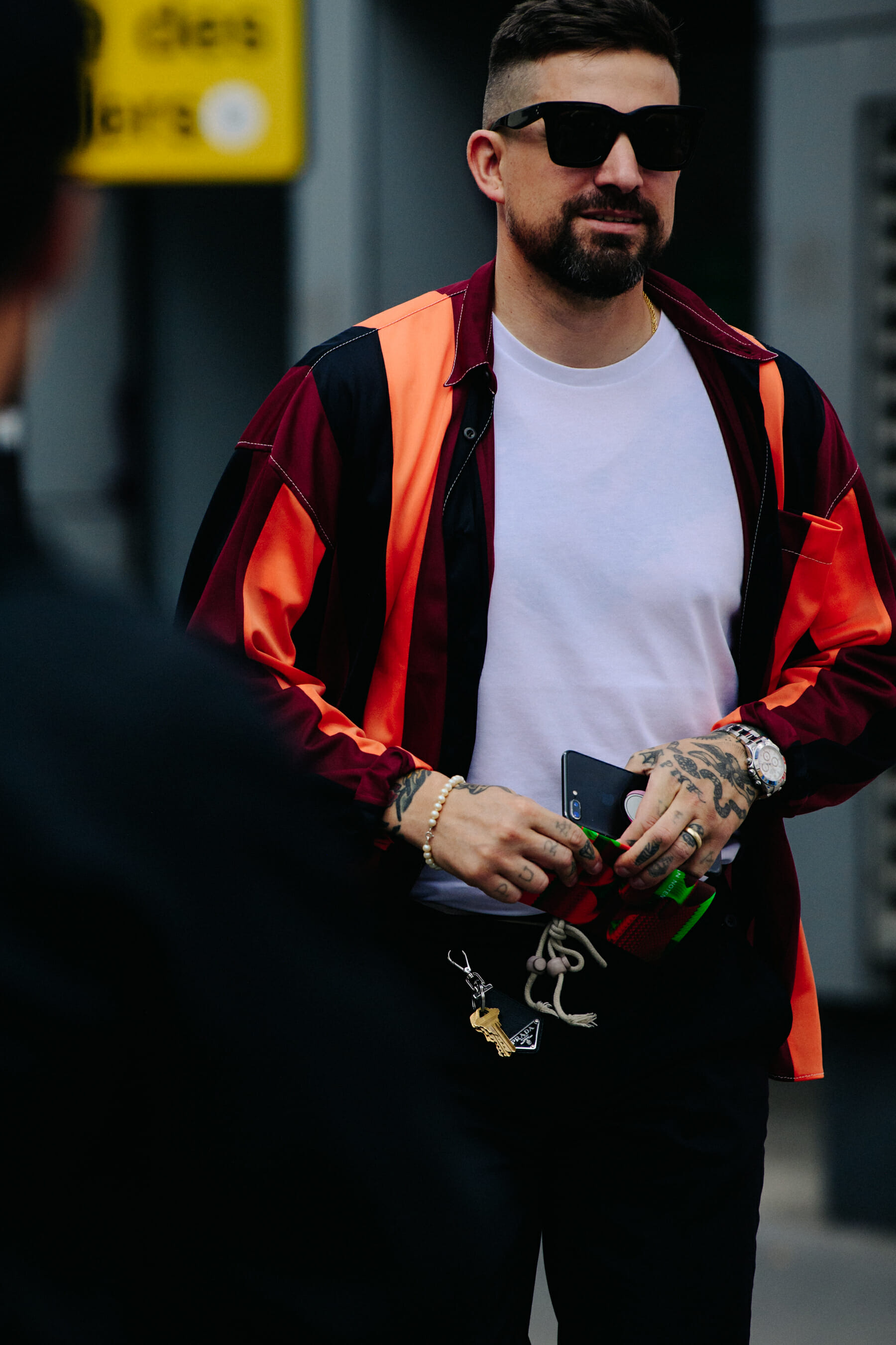 Man wearing striped orange shirt