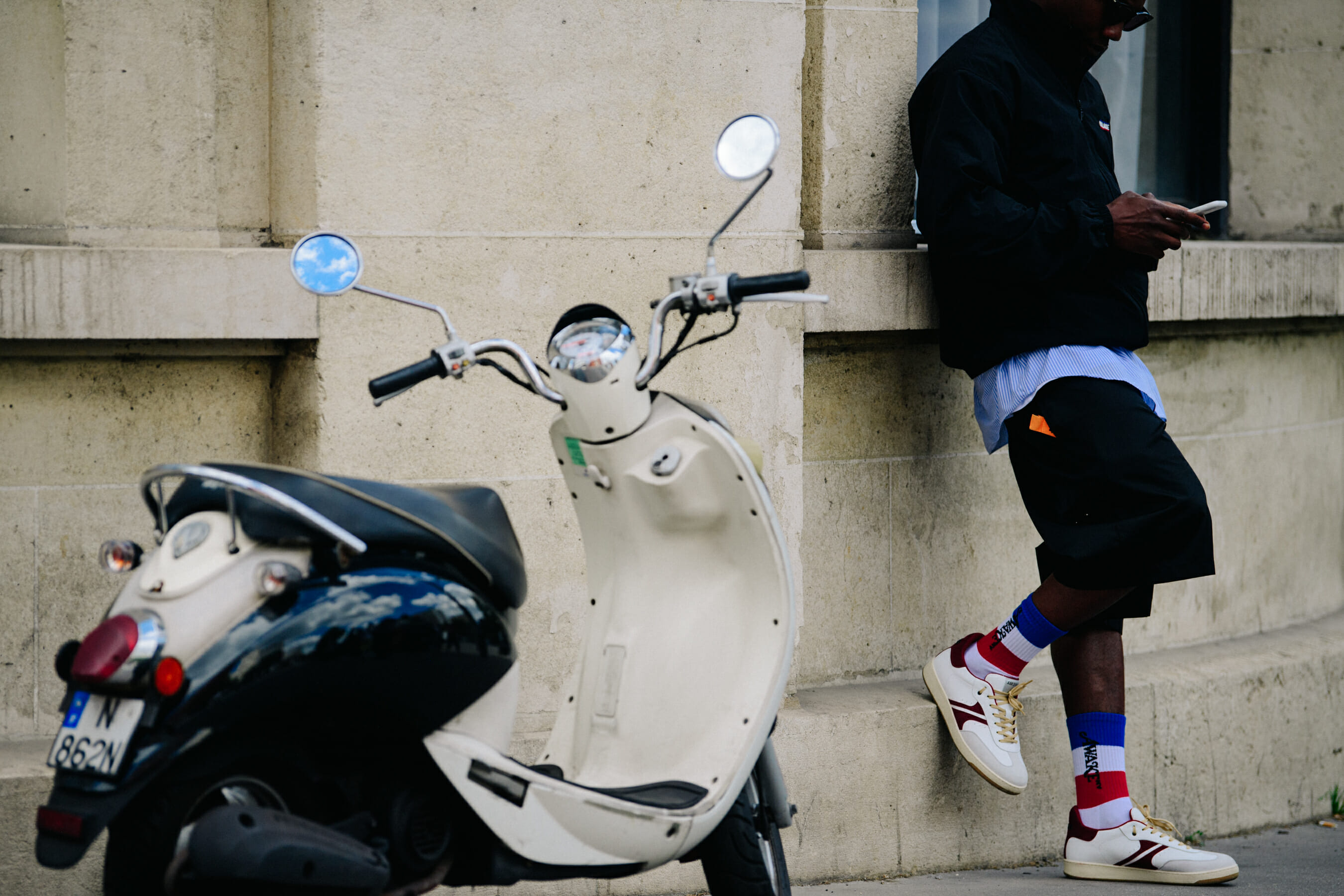 Man wearing red white and blue socks