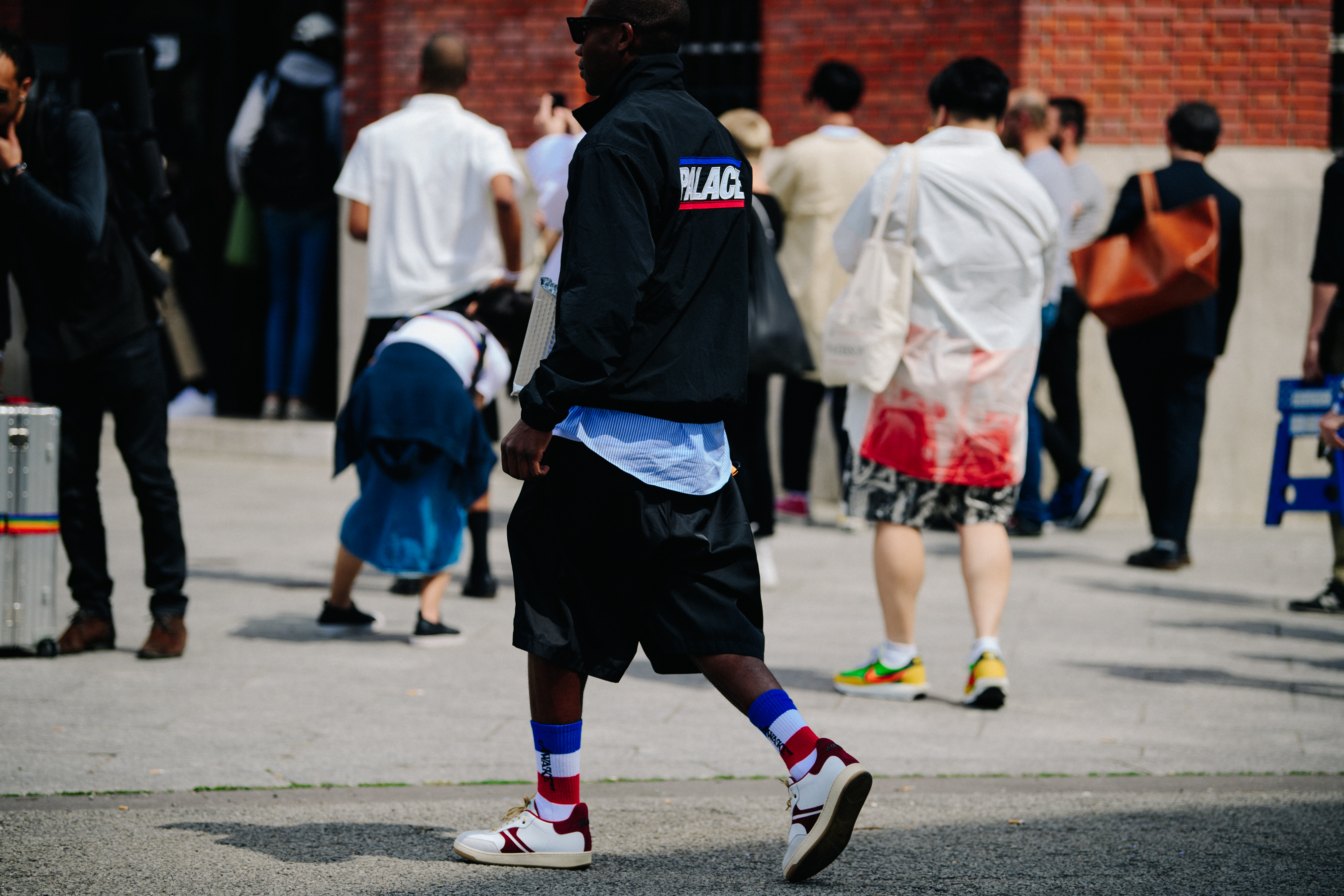 Man wearing red white and blue socks