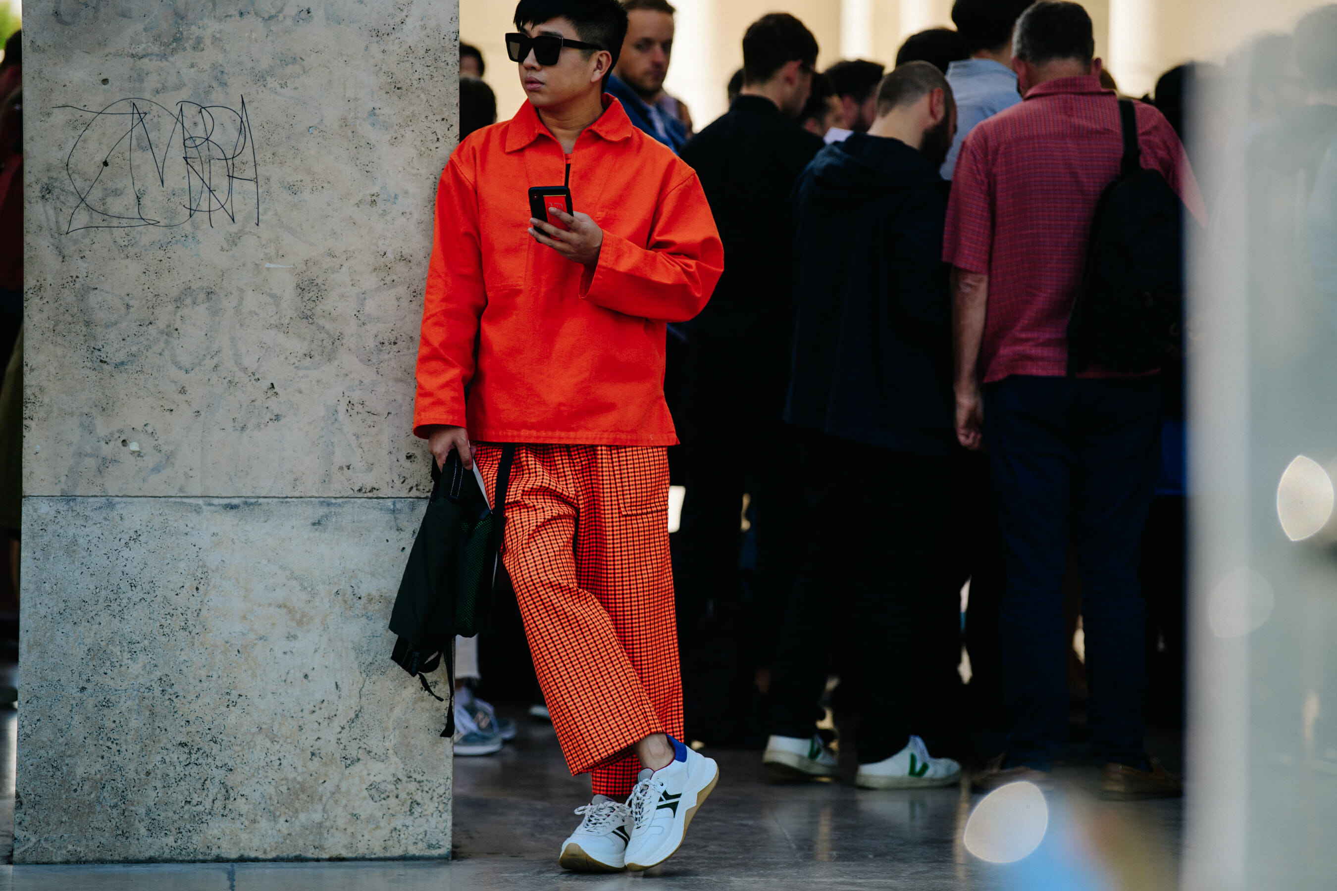 Chinese man wearing orange outfit