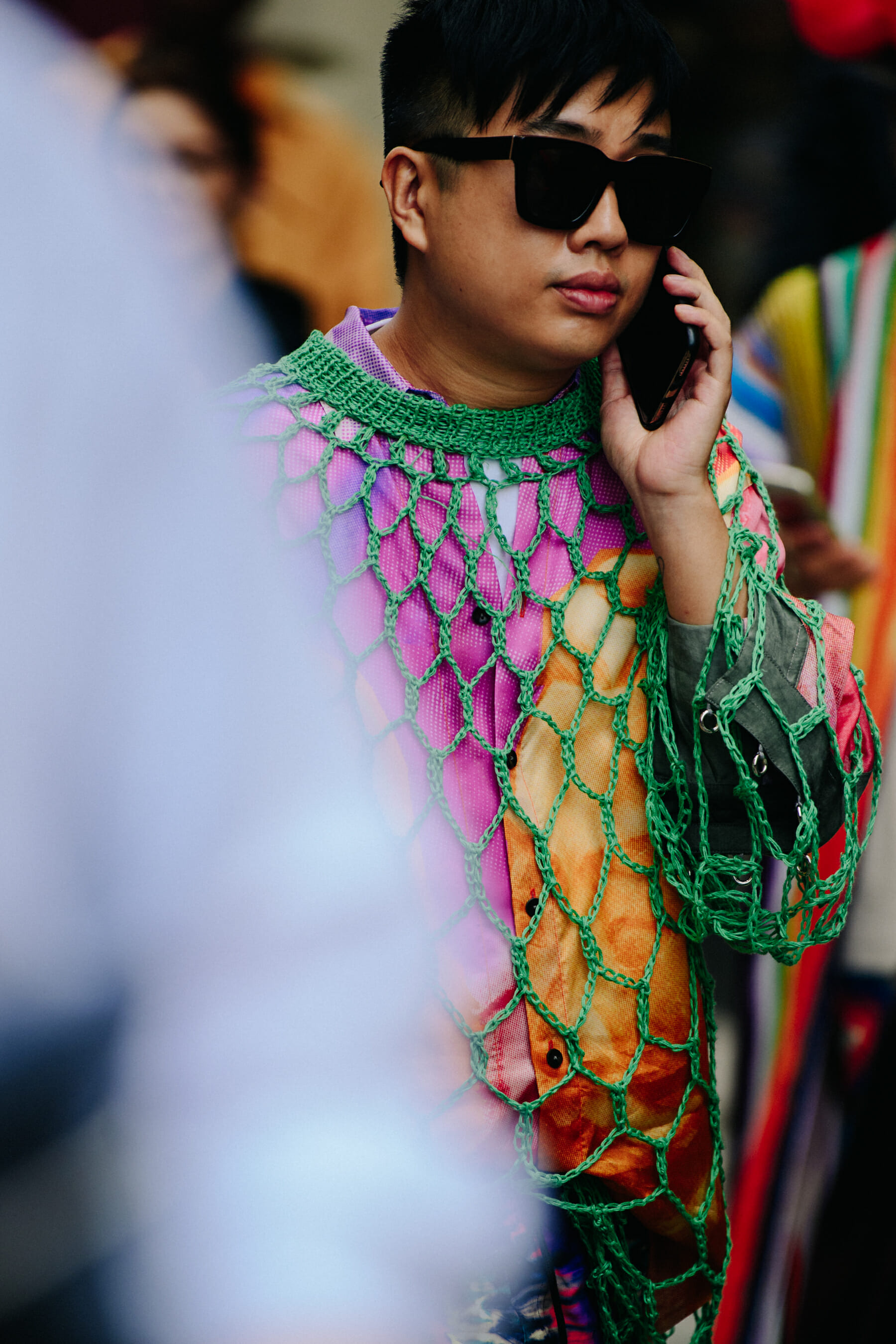 Man wearing green net shirt