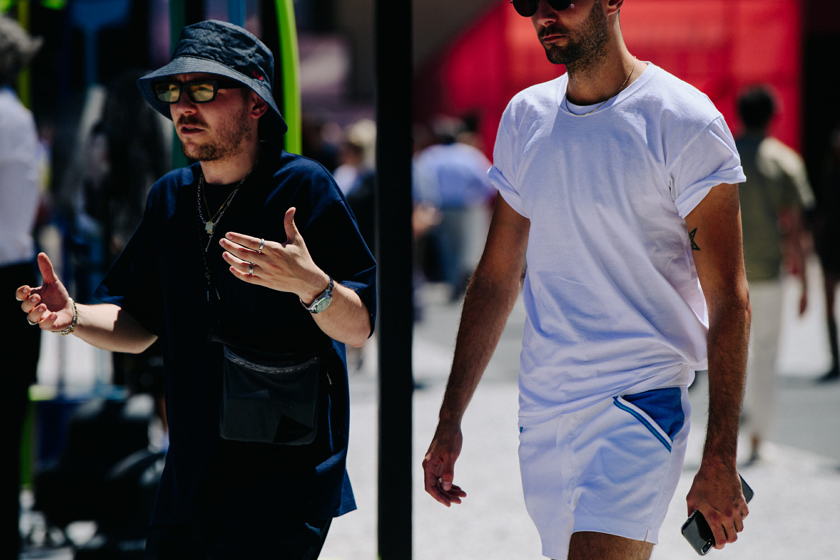 Two men wearing black and white shirts