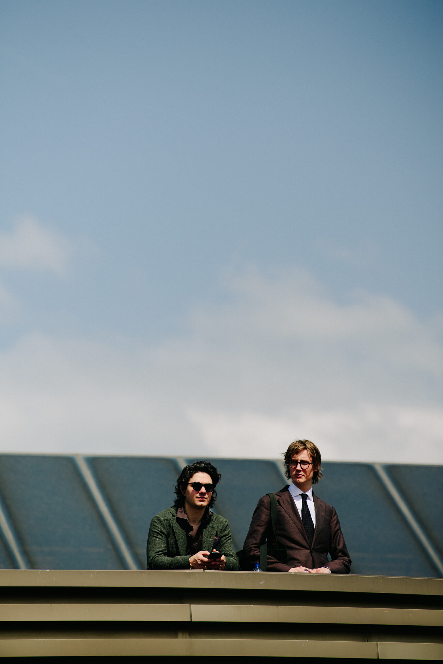 Two men wearing suits