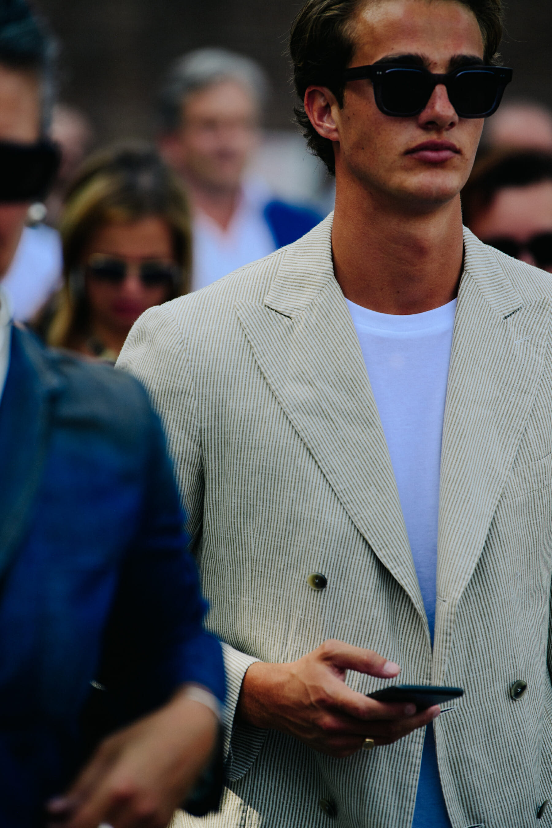 Man wearing pale suit jacket