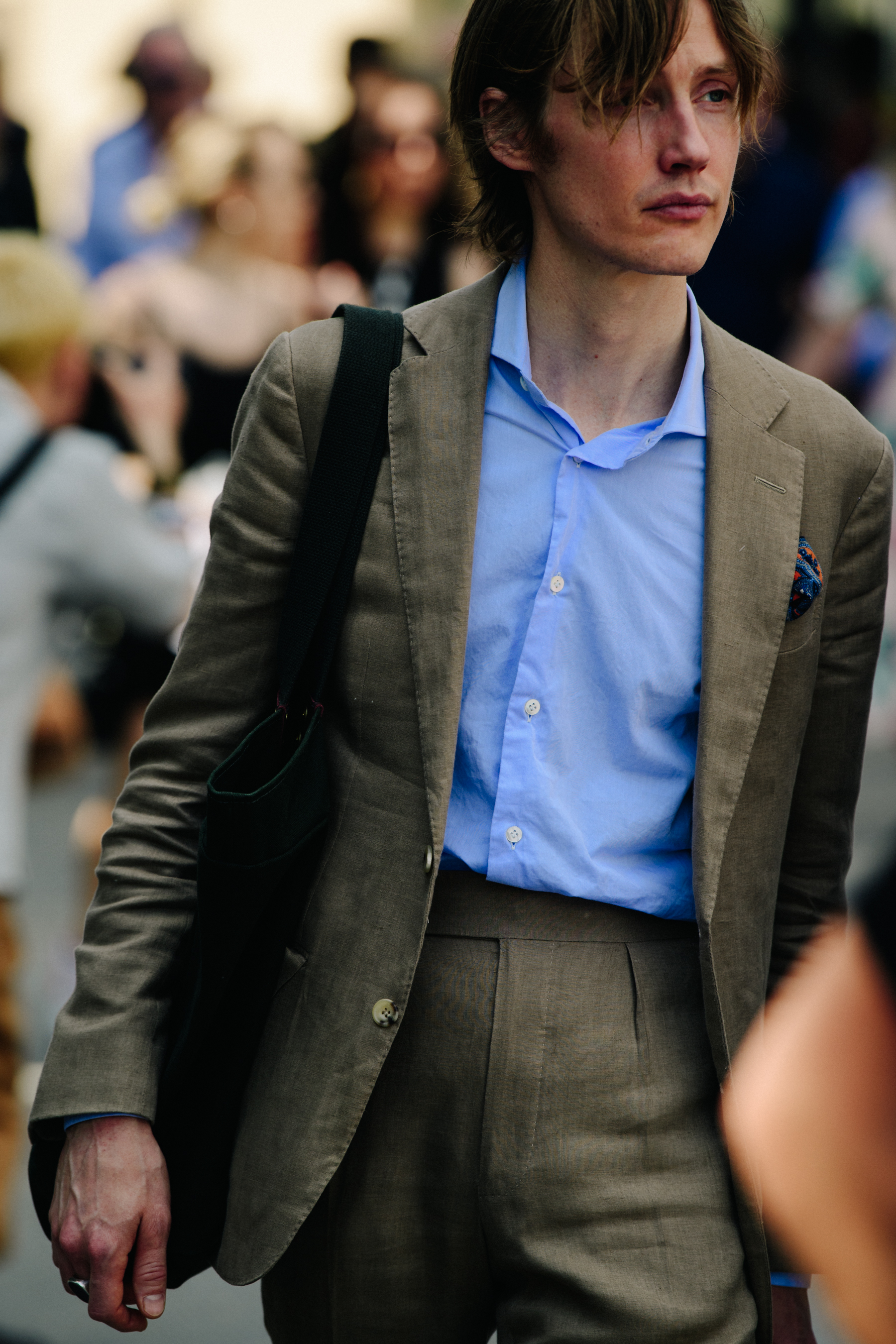 Man wearing brown suit