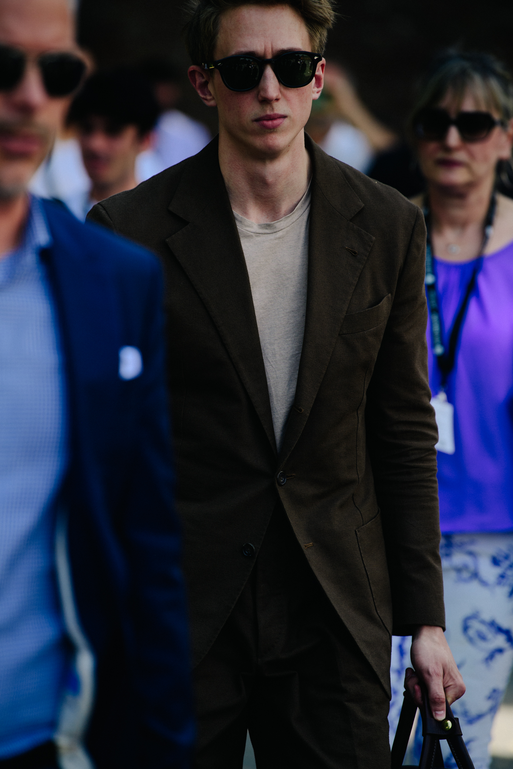 Man wearing brown suit