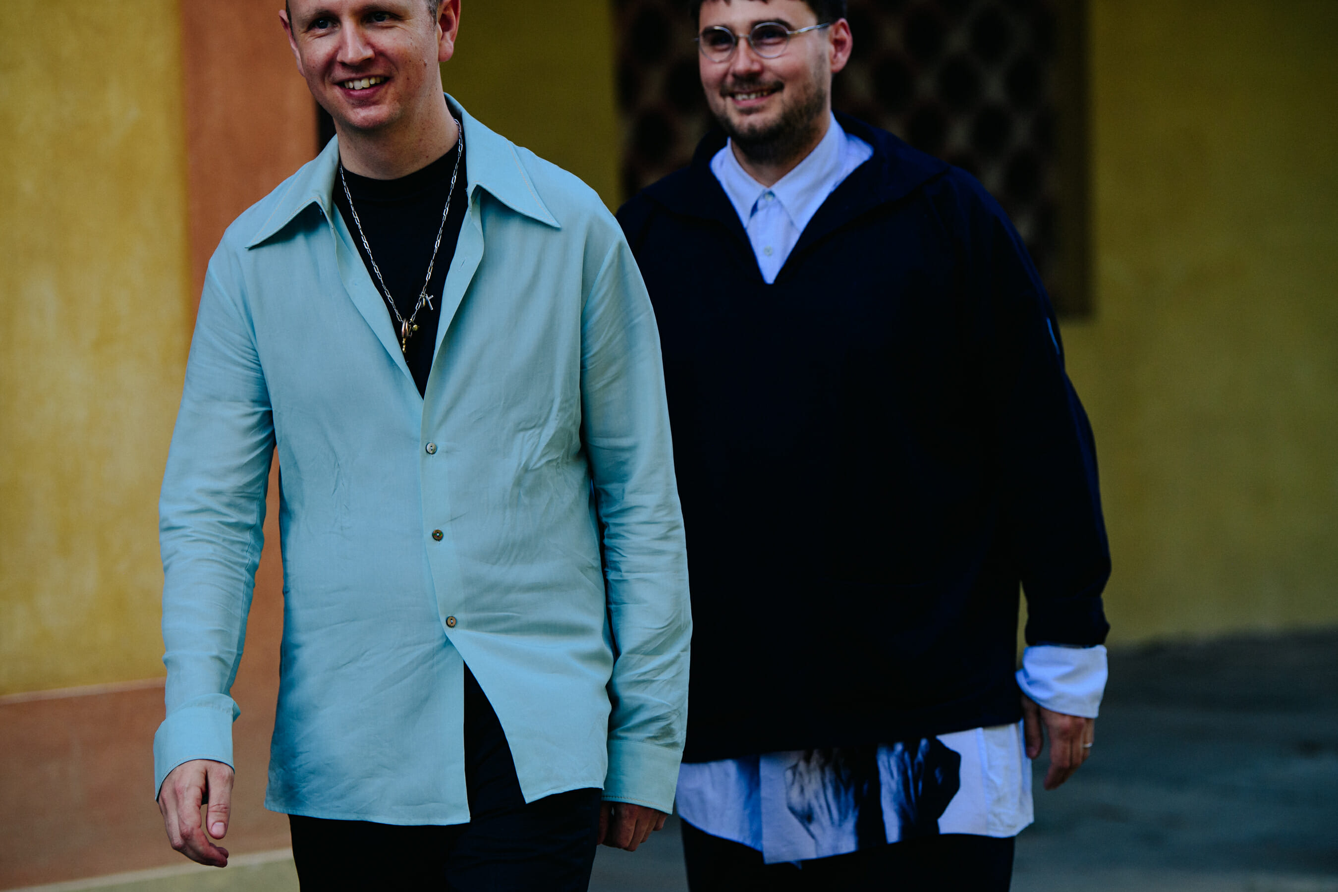 Two men wearing shirts