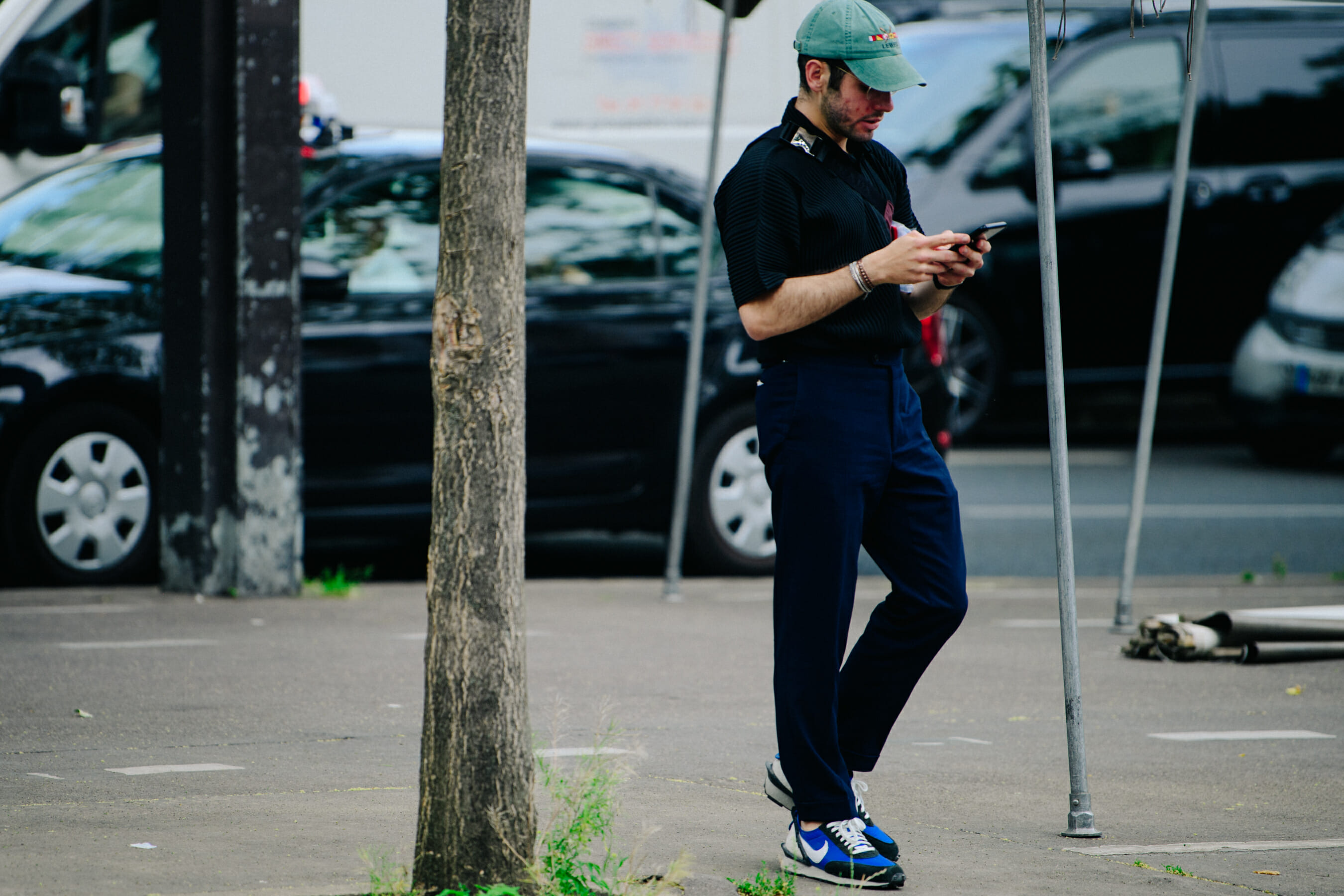 Man wearing Prada bag