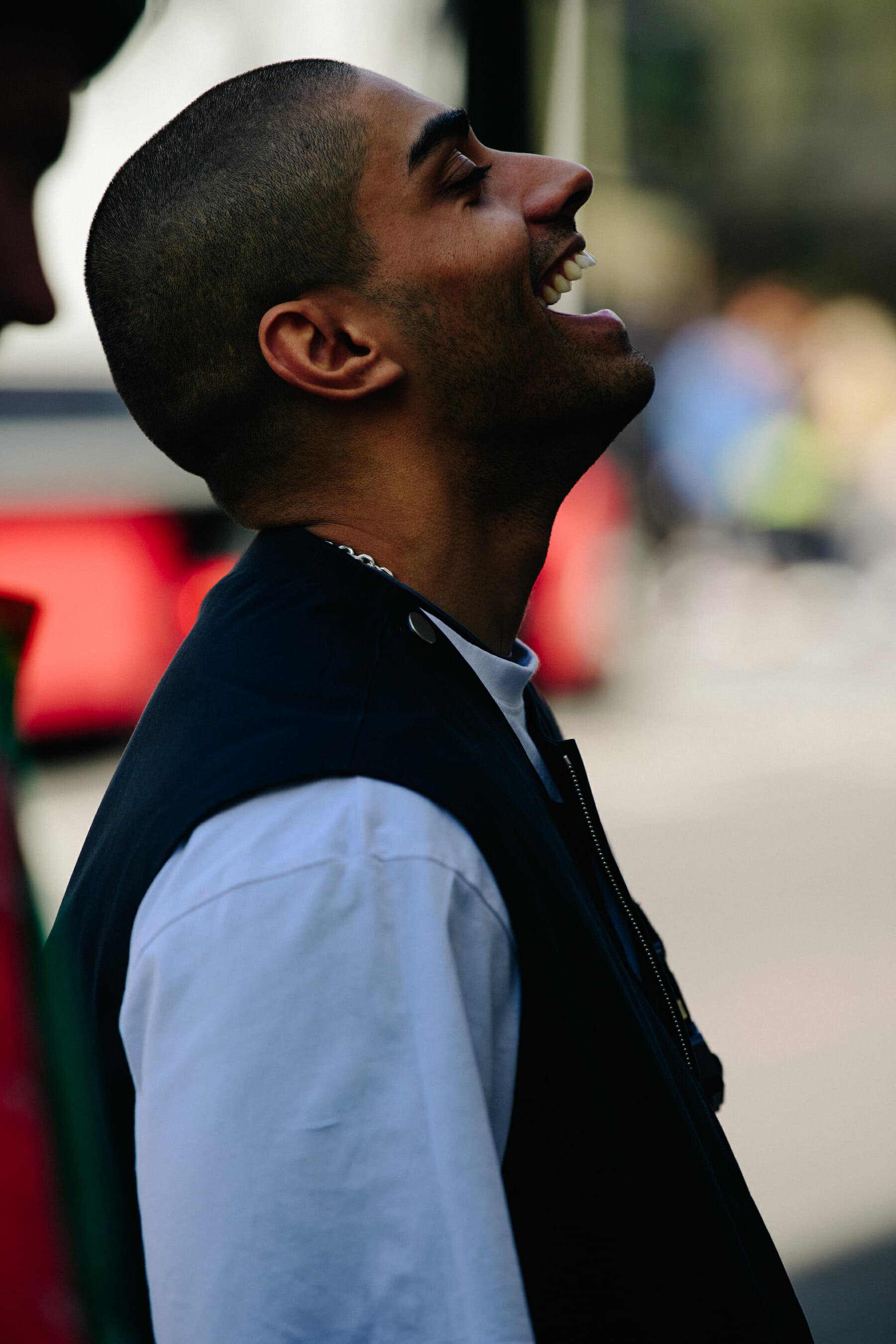 Man wearing blue vest