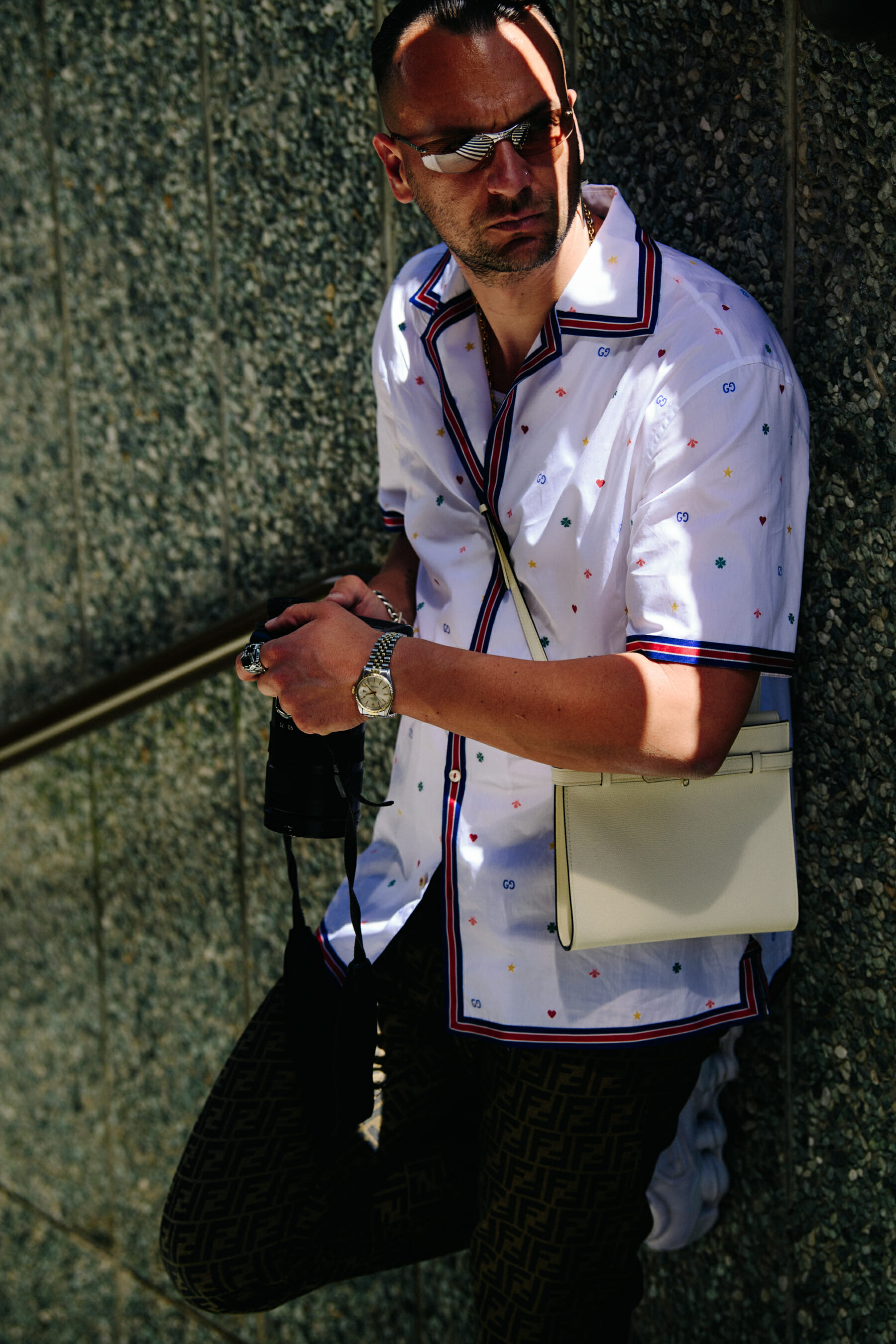 French man wearing white shirt