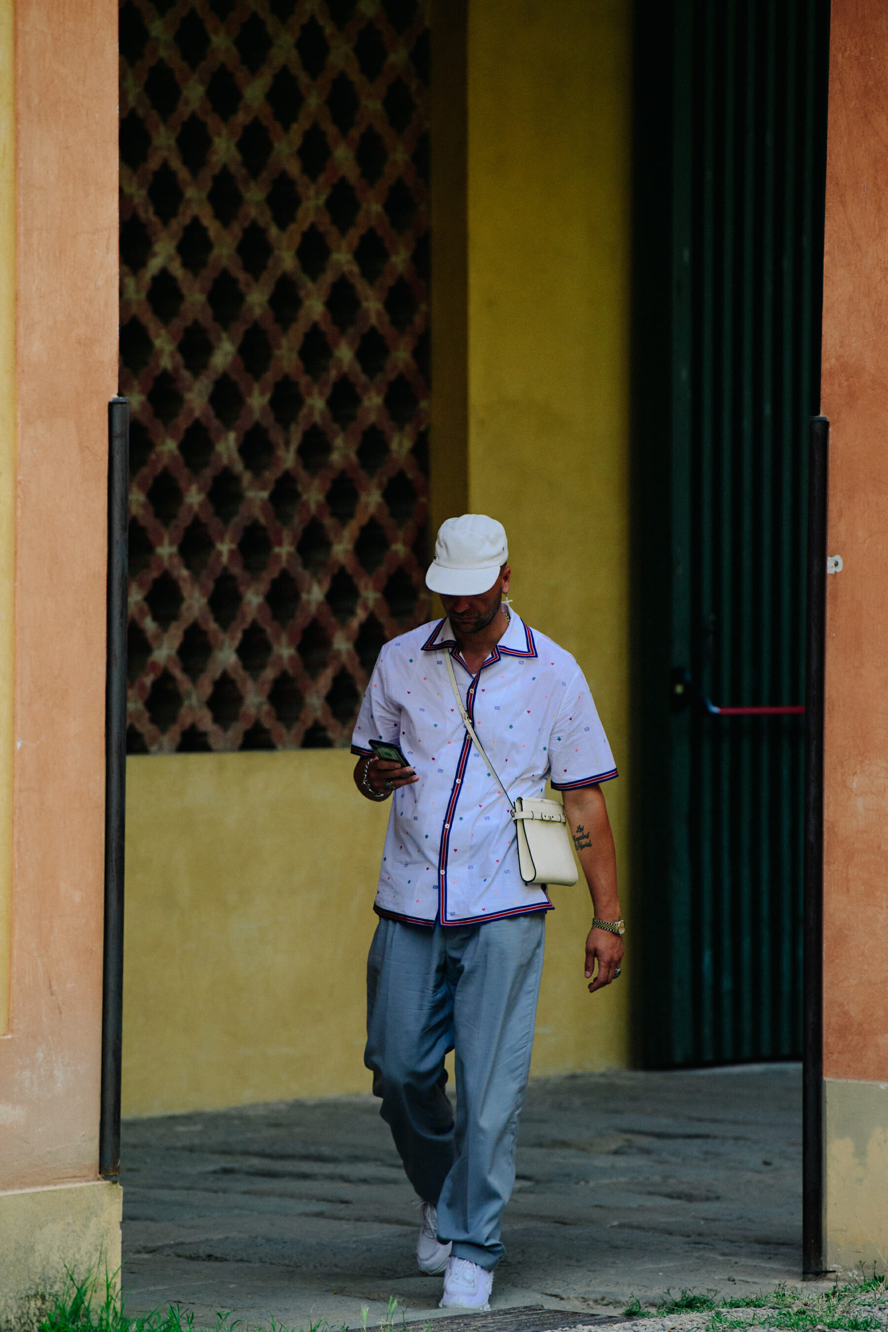 Man wearing white shirt and cap