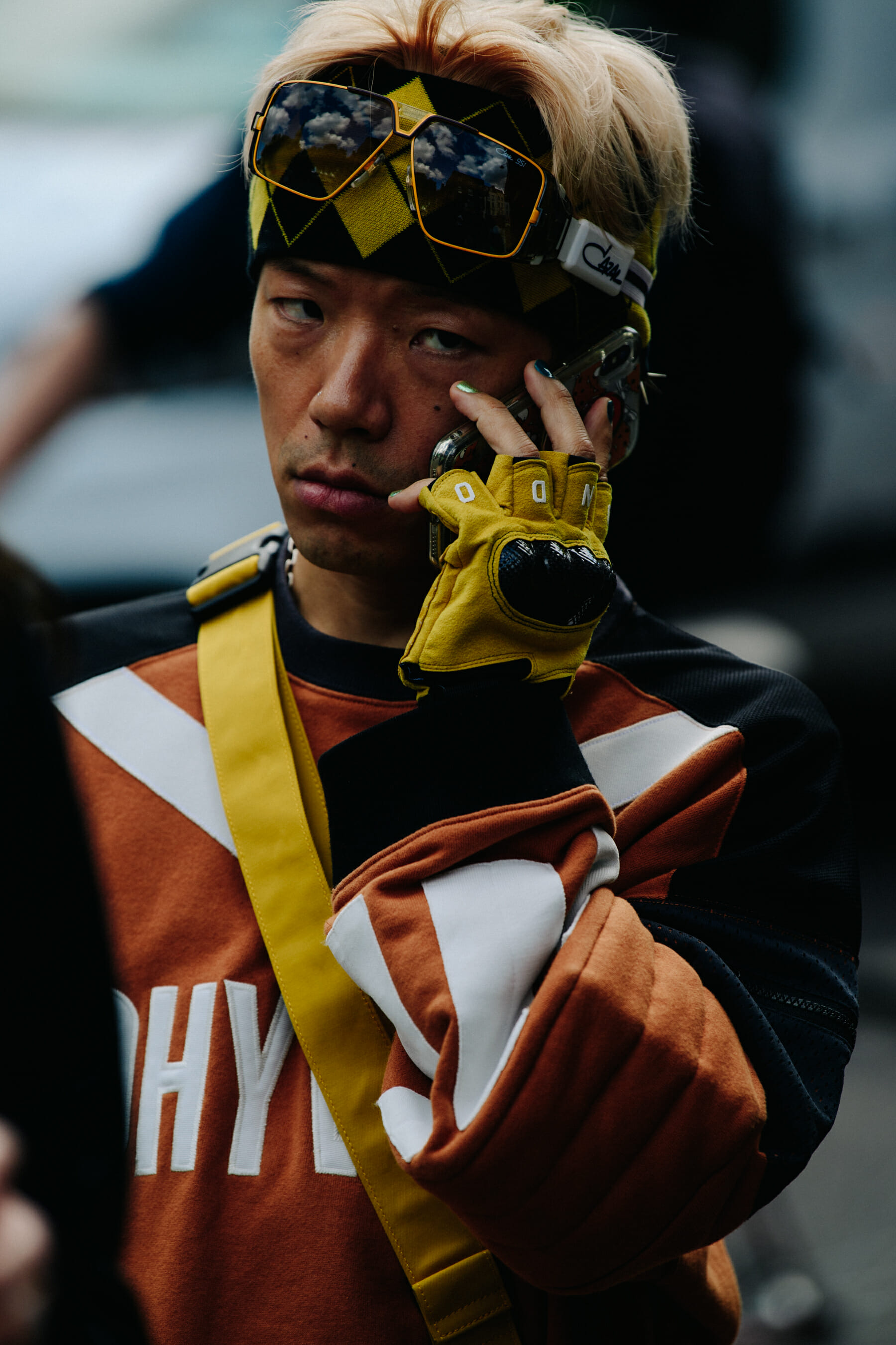 Man wearing yellow gloves