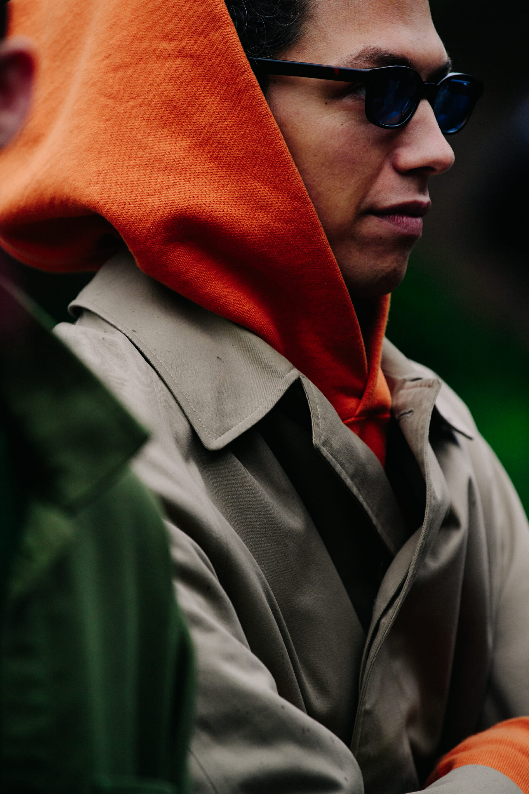 Man wearing orange hoodie