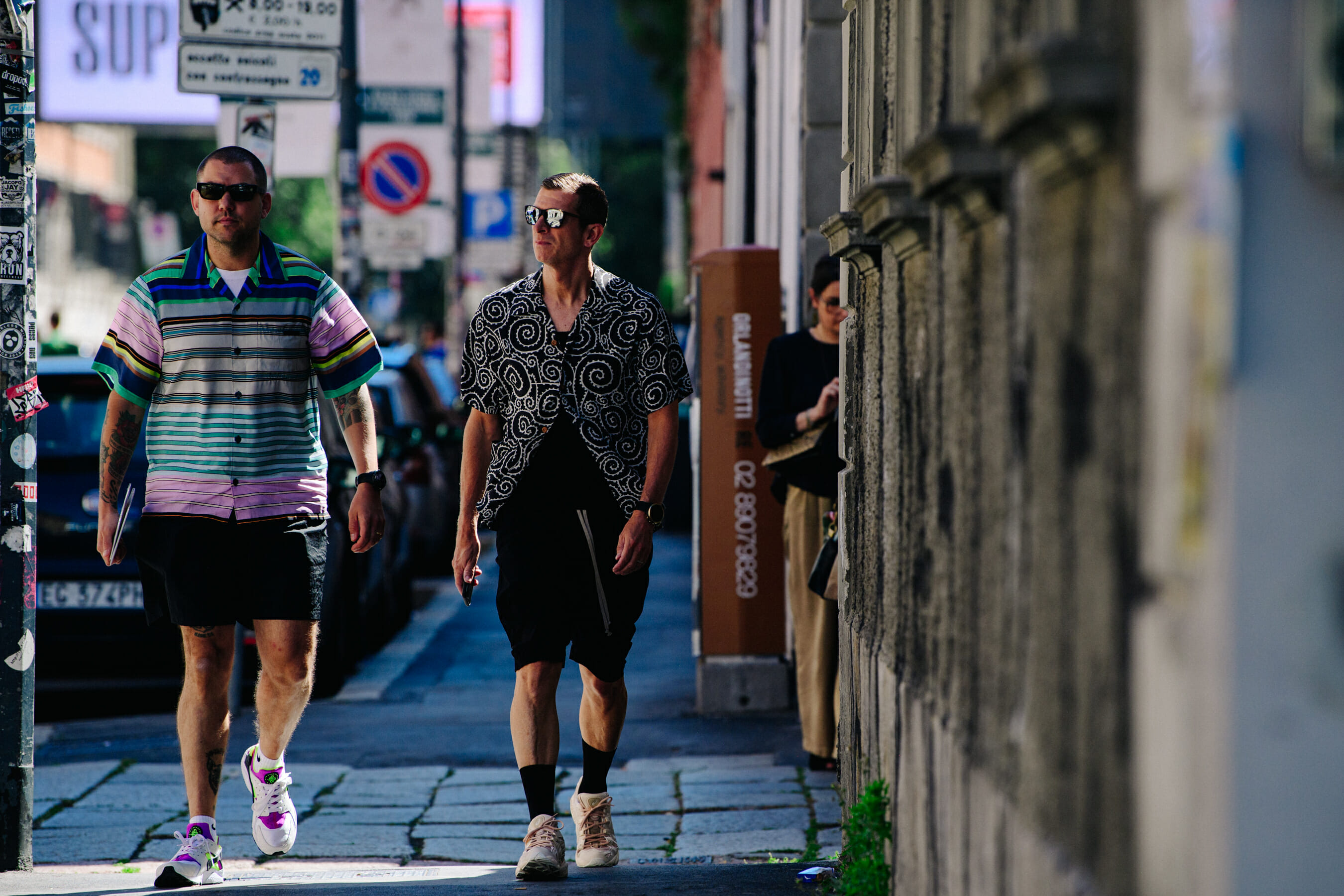 Two men wearing pattern shirts