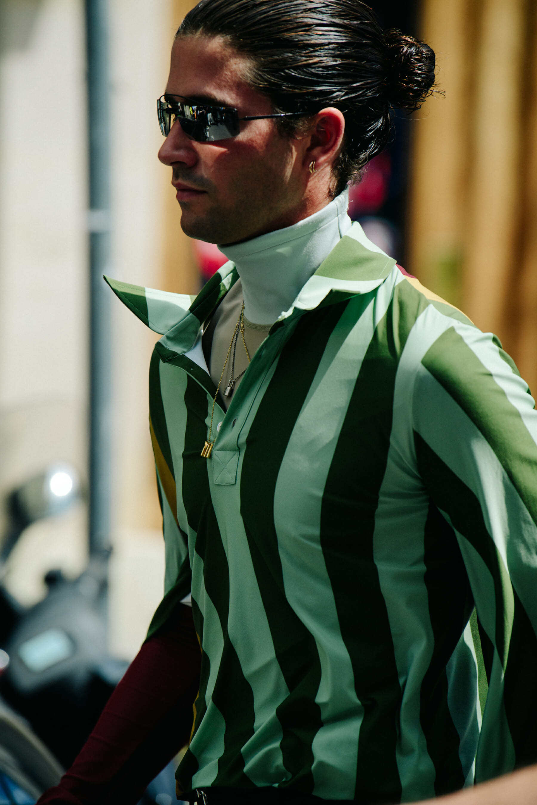 Man wearing green striped shirt