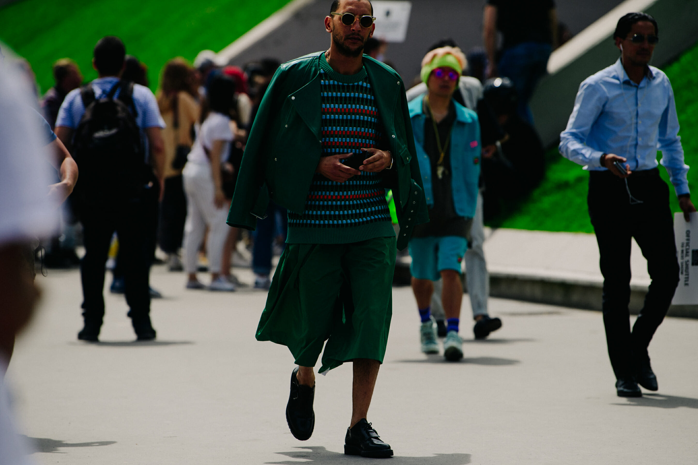Man wearing green outfit