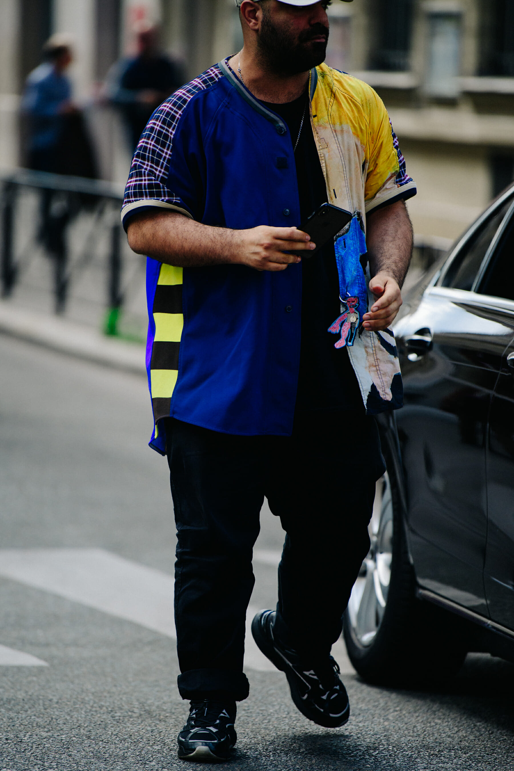 Man wearing blue baseball tee